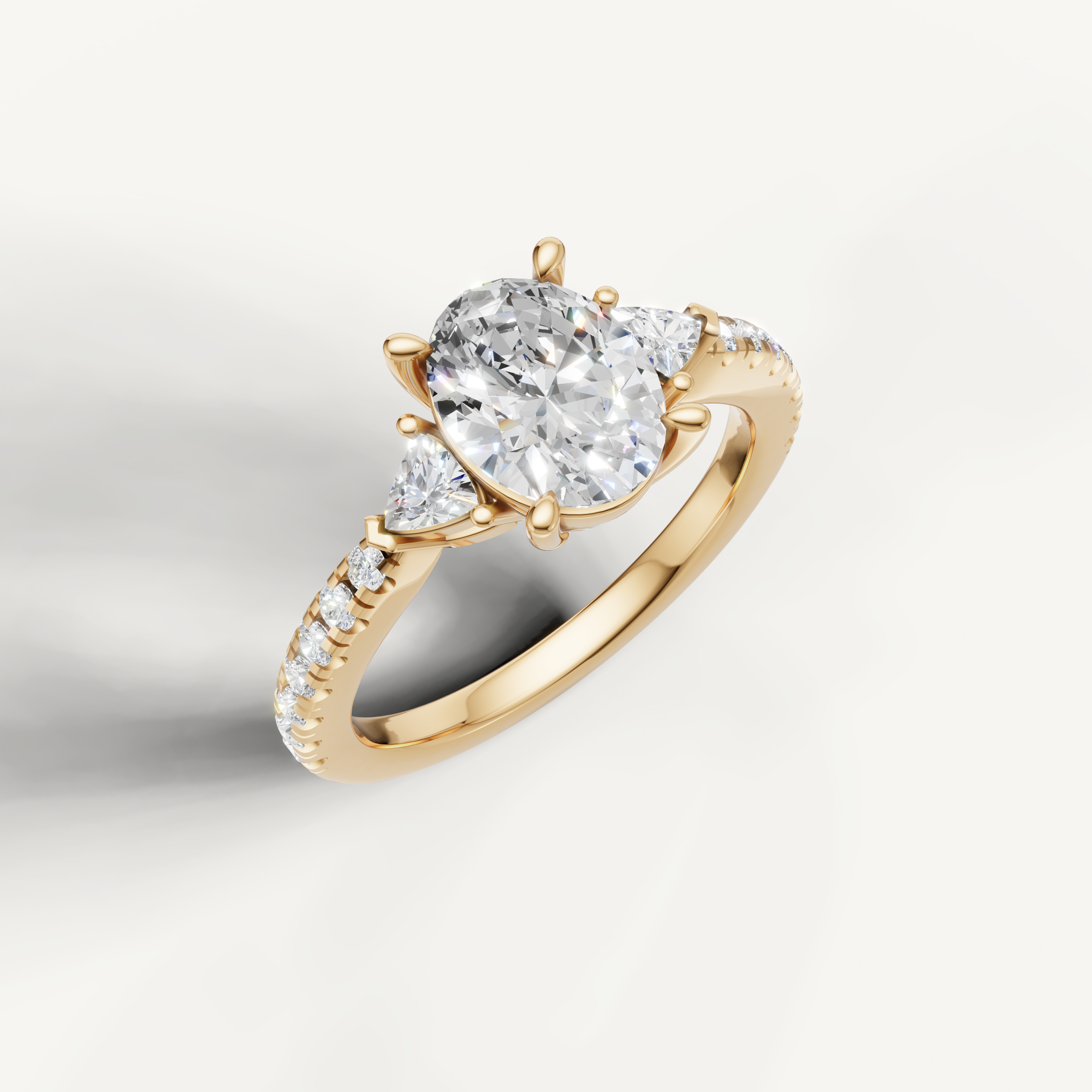 Close-up front view of oval cut lab grown diamond ring with pavé band in 14K gold