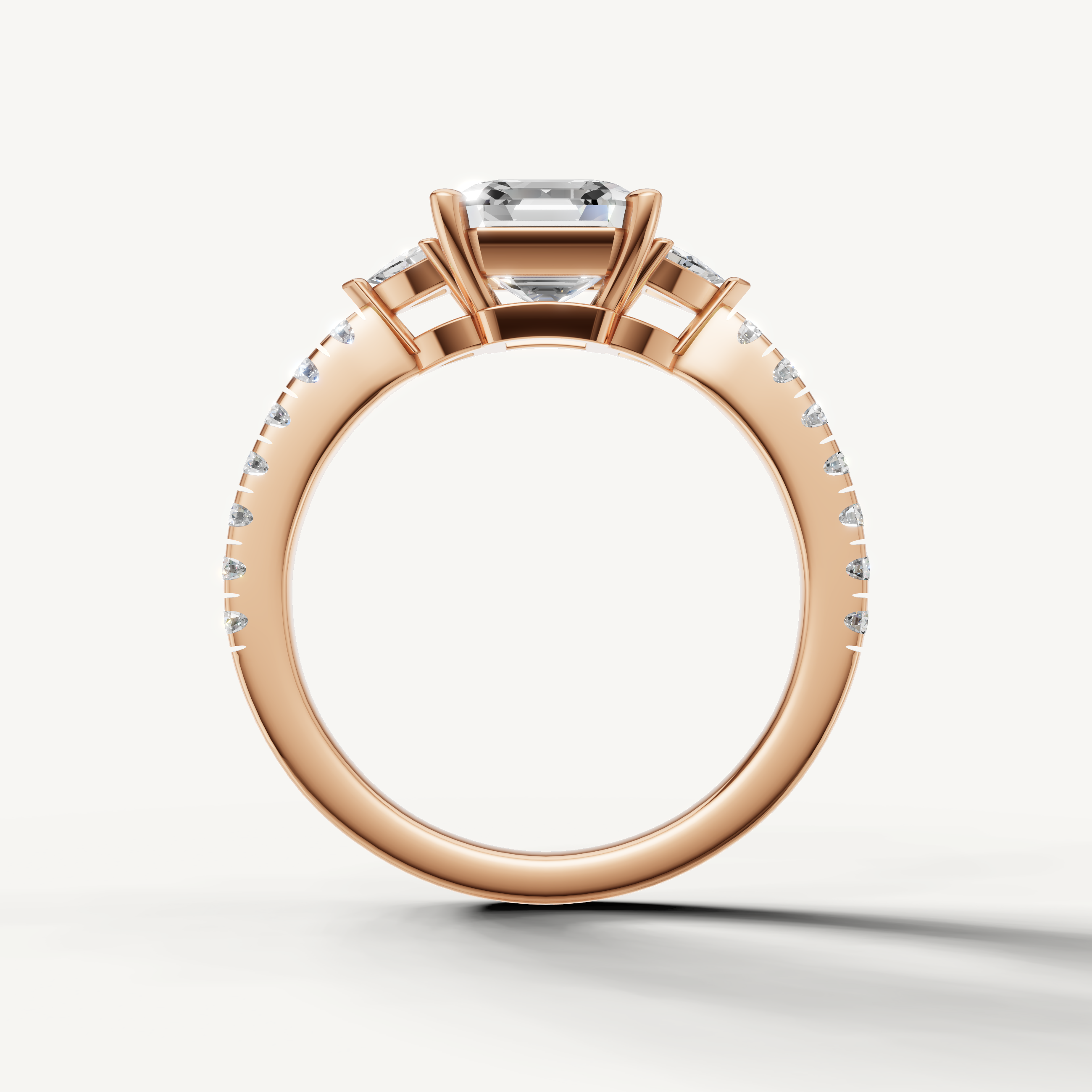 Luxury three-stone engagement ring with Asscher cut lab grown diamond in 14K gold