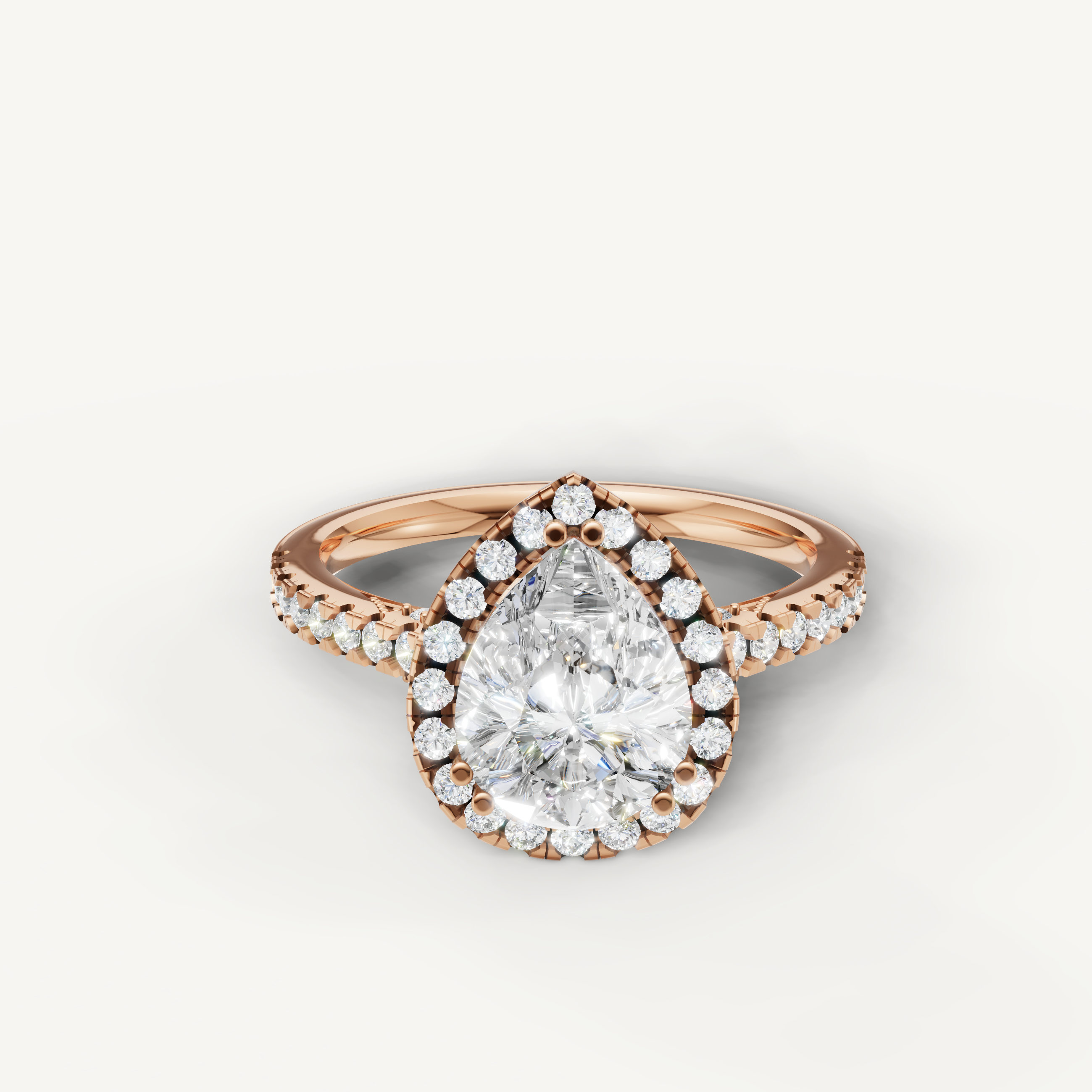 Pear cut lab grown diamond halo engagement ring in 14K rose gold with pavé diamond band by Raul Diamonds