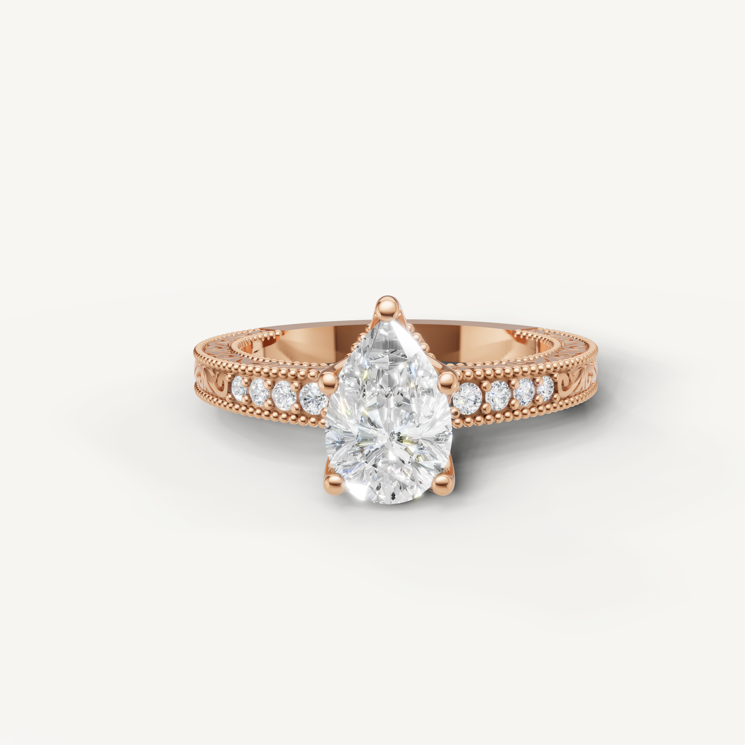 Vintage pear cut lab grown diamond engagement ring in 14K rose gold with intricate pavé and milgrain detailing by Raul Diamonds.