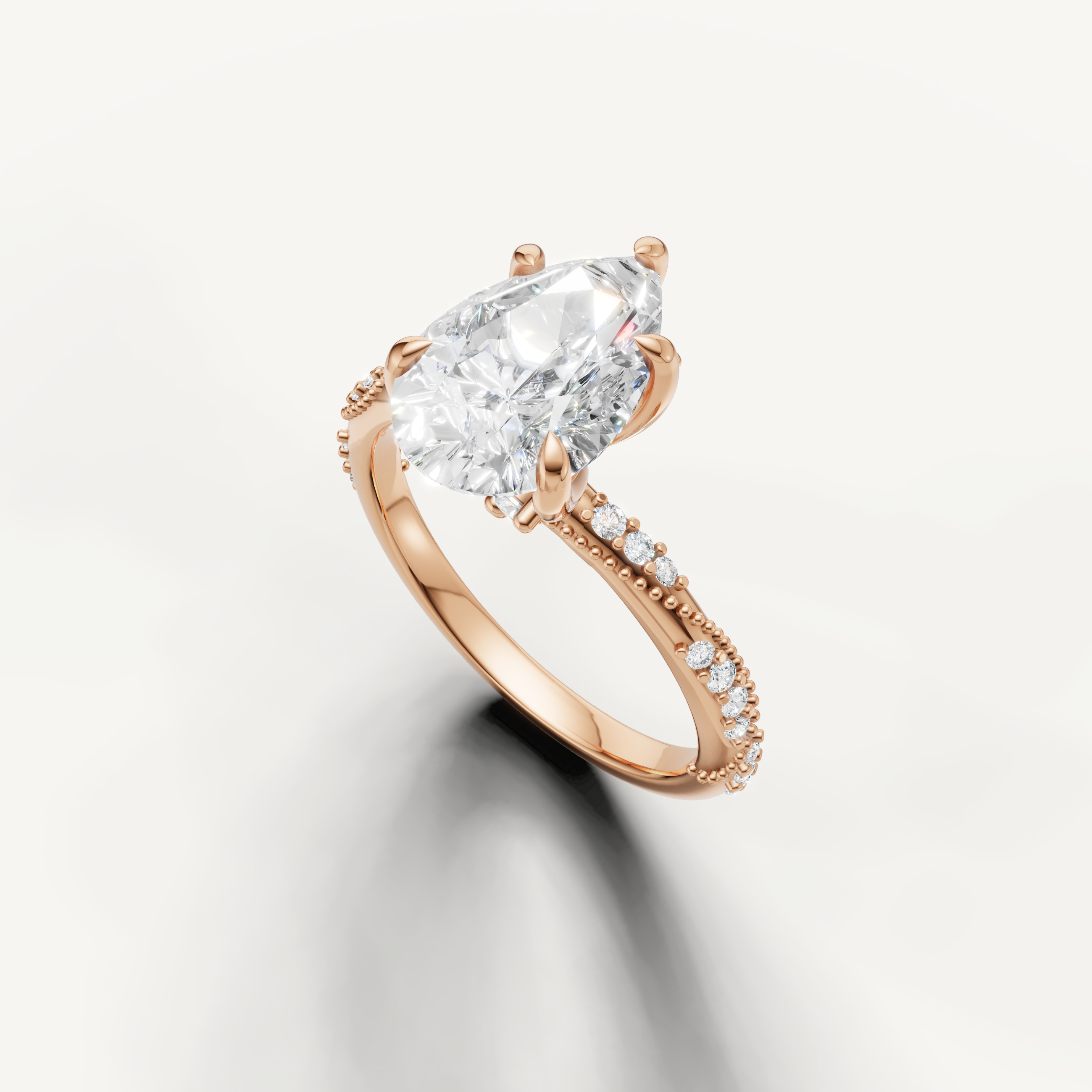 pear shaped lab grown diamond ring with delicate twisted pavé setting rose gold
