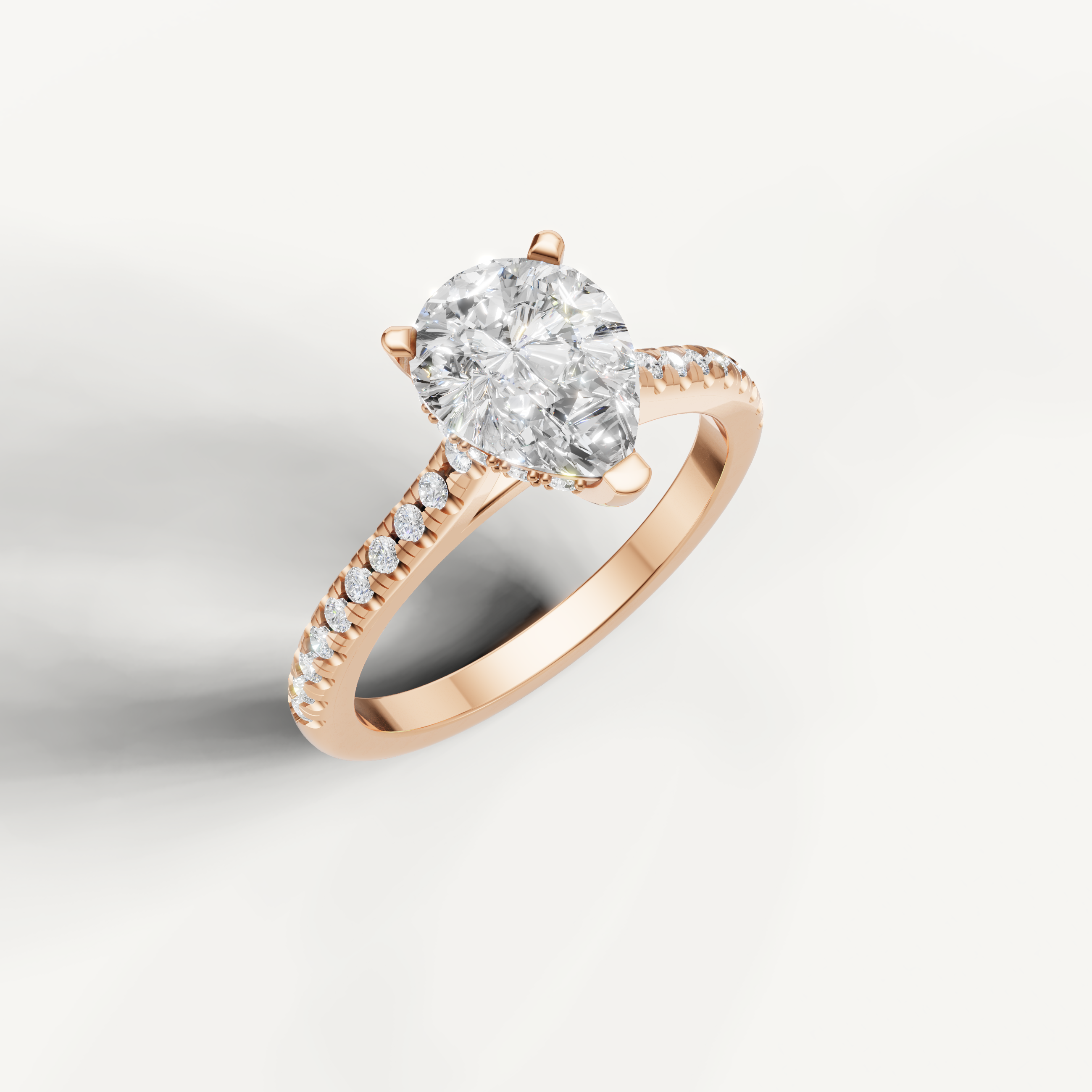Romantic pear shaped lab grown diamond solitaire ring in rose gold with shimmering pavé diamonds