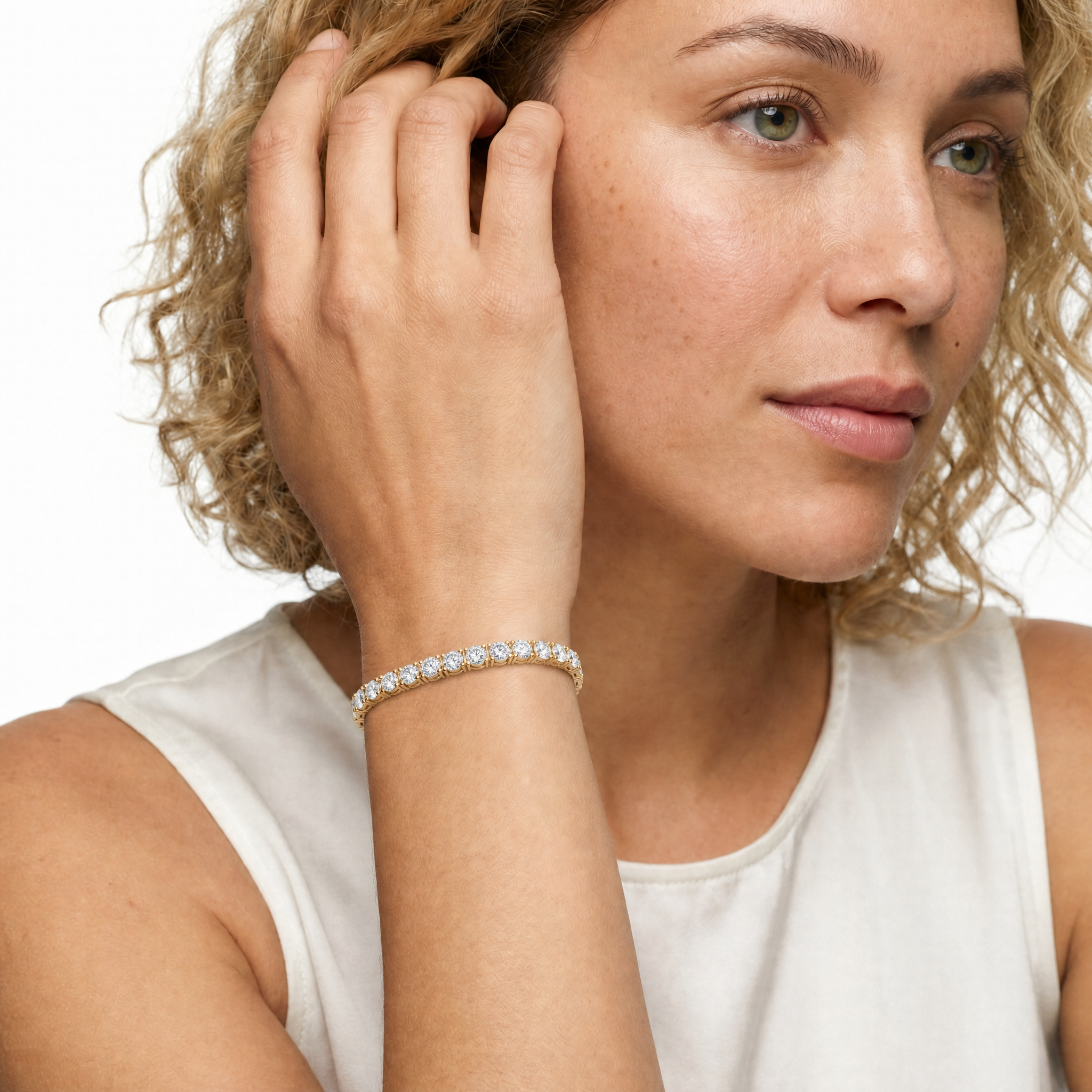 Model wearing Raul Diamonds round diamond tennis bracelet in yellow gold
