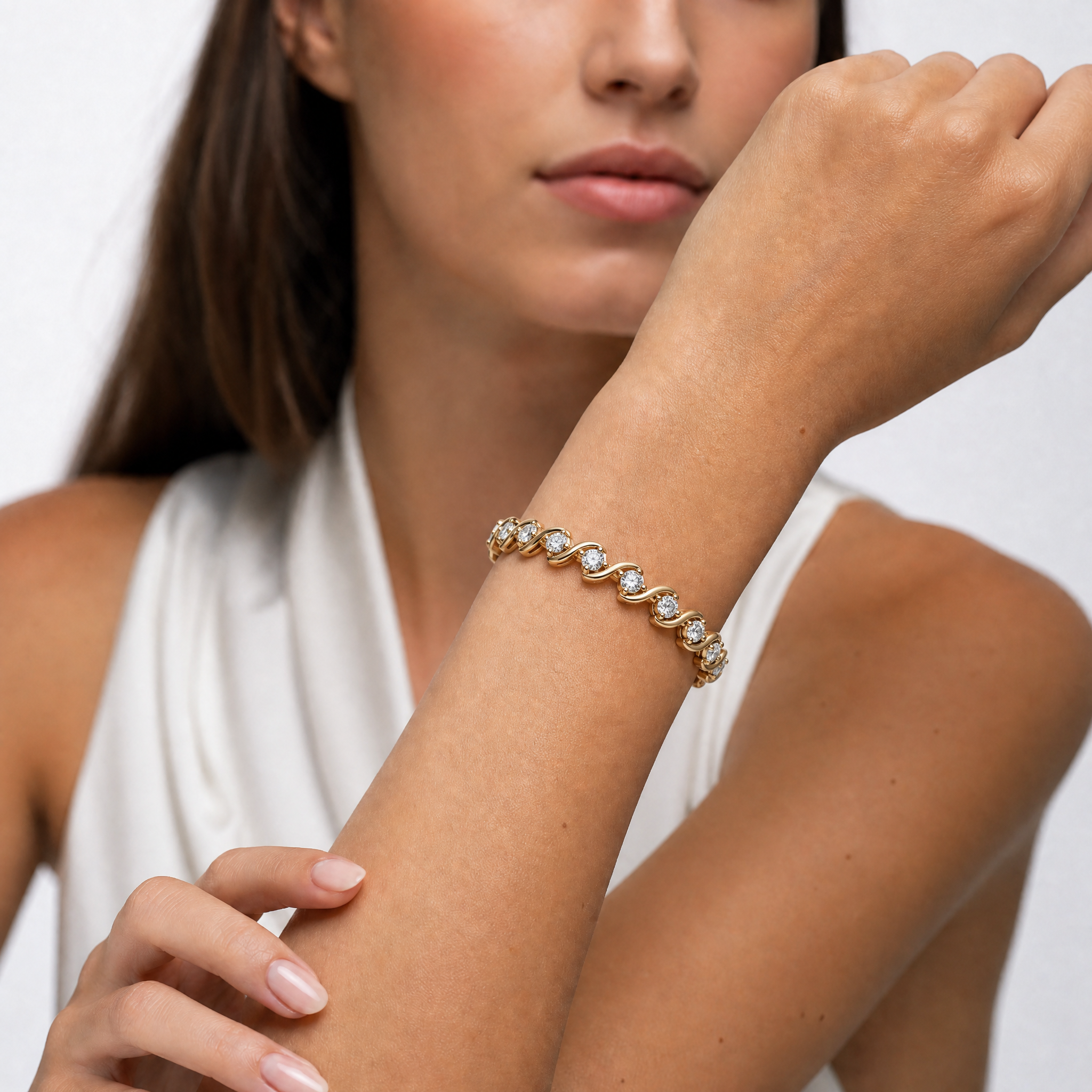 Model wearing Raul Diamonds twisted diamond bracelet in luxurious yellow gold finish
