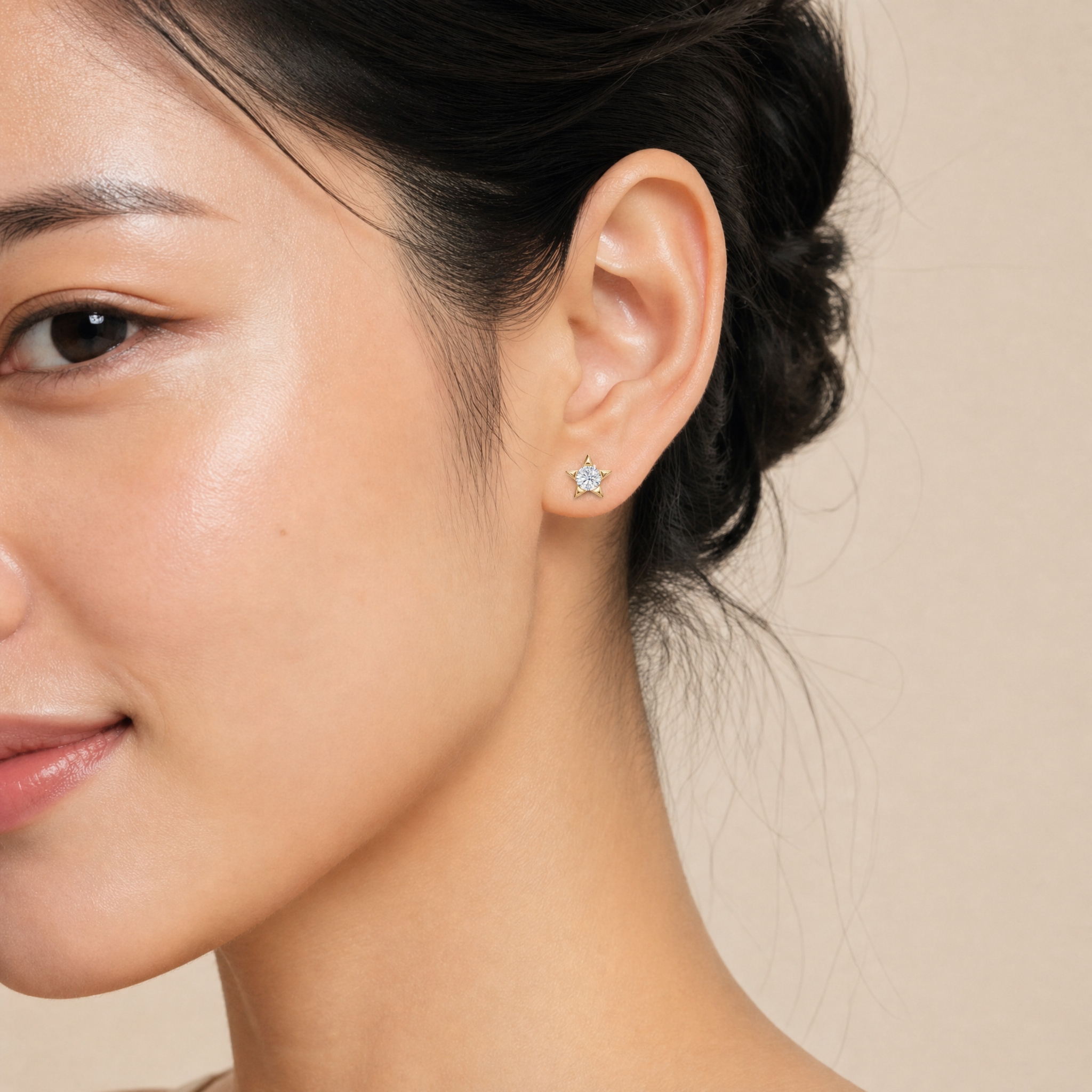 Elegant model wearing Raul Diamonds celestial star diamond stud earrings with luxury sparkle