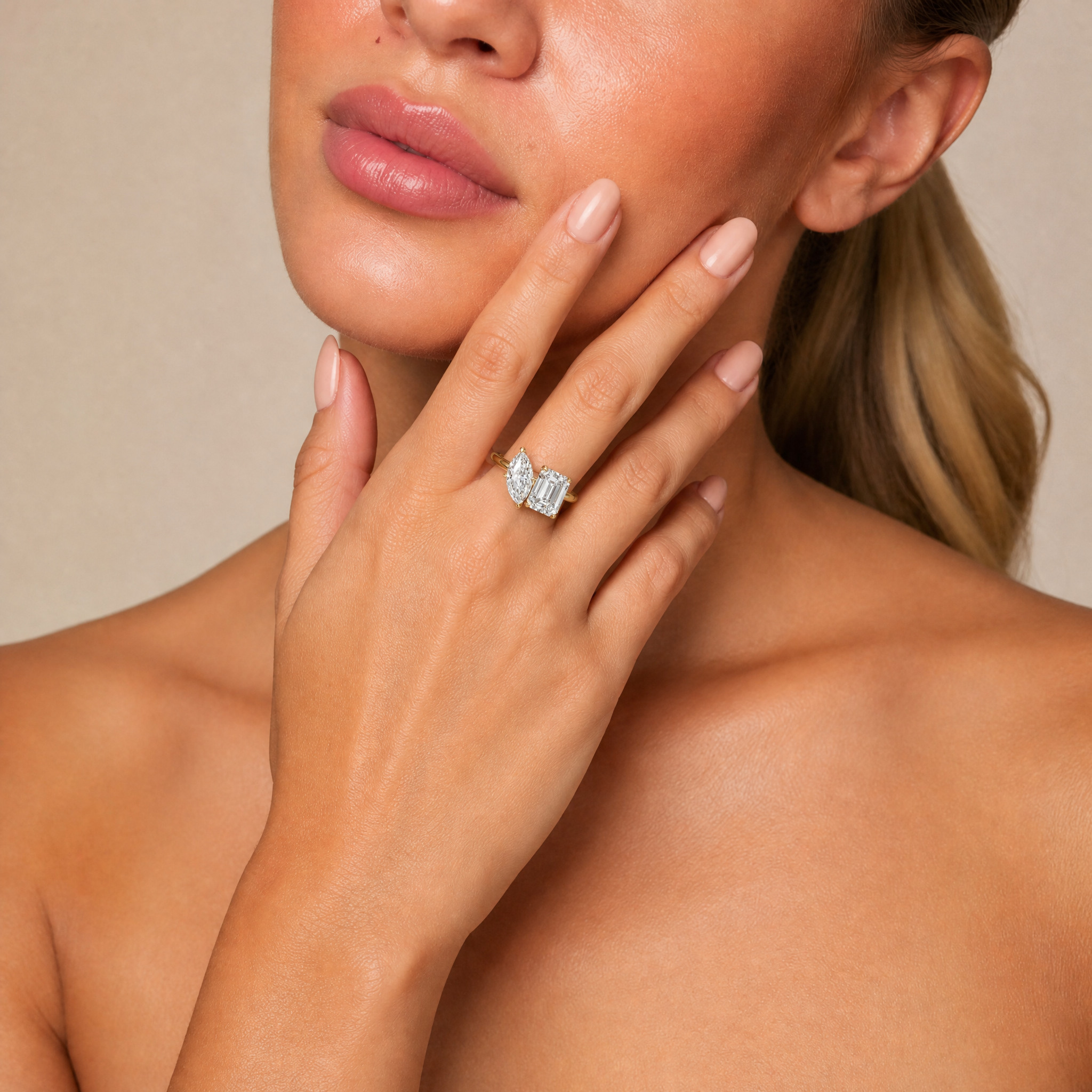 Model Olivia Bennett wearing Raul Diamonds yellow gold toi et moi ring with marquise and emerald cut diamonds
