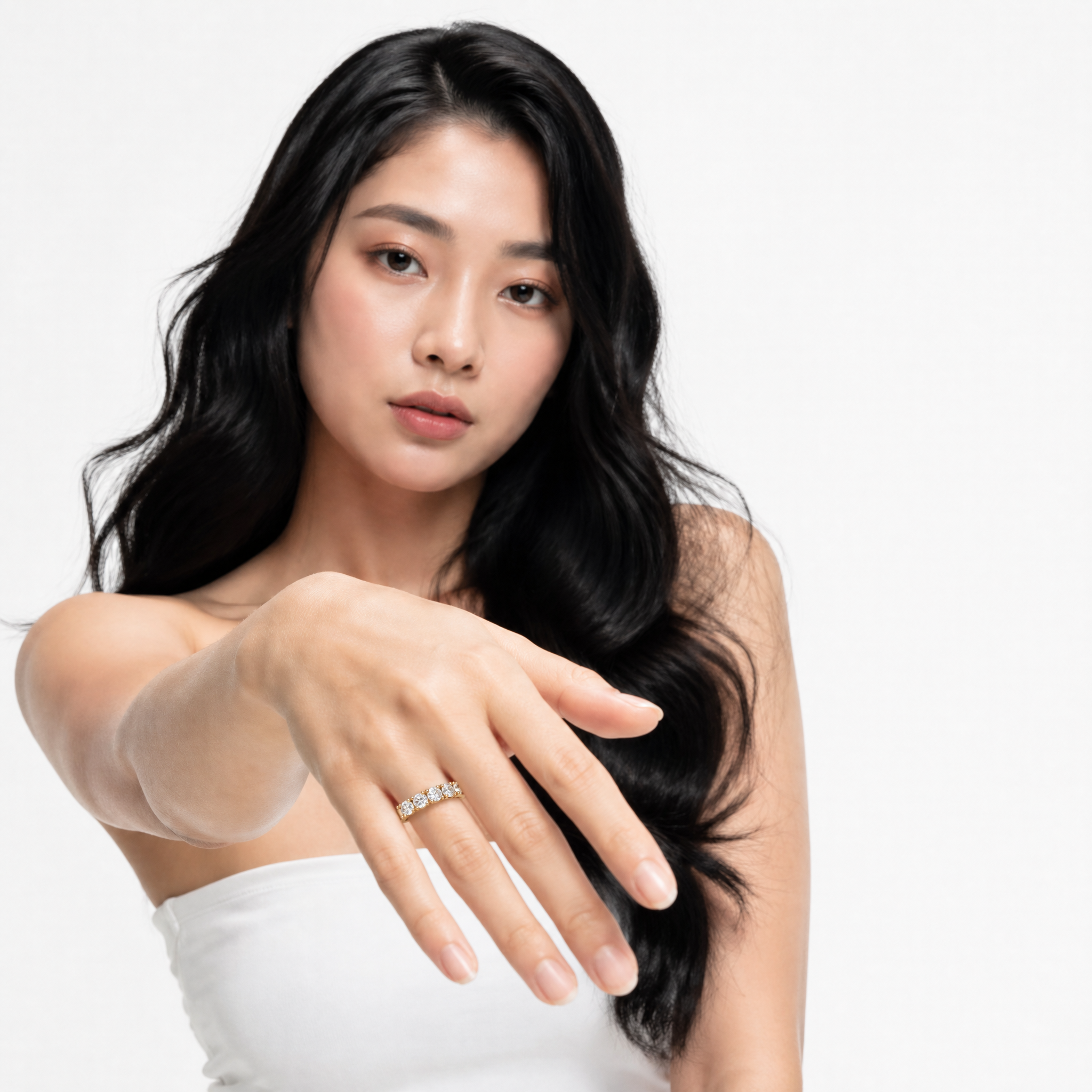 Female model wearing Raul Diamonds yellow gold five stone diamond wedding band with luxury elegant styling