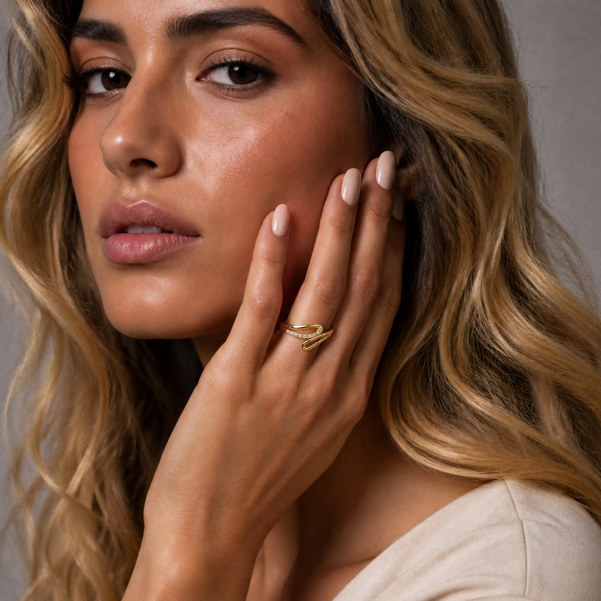 Female model wearing Raul Diamonds yellow gold open swirl diamond wedding band with elegant contemporary styling