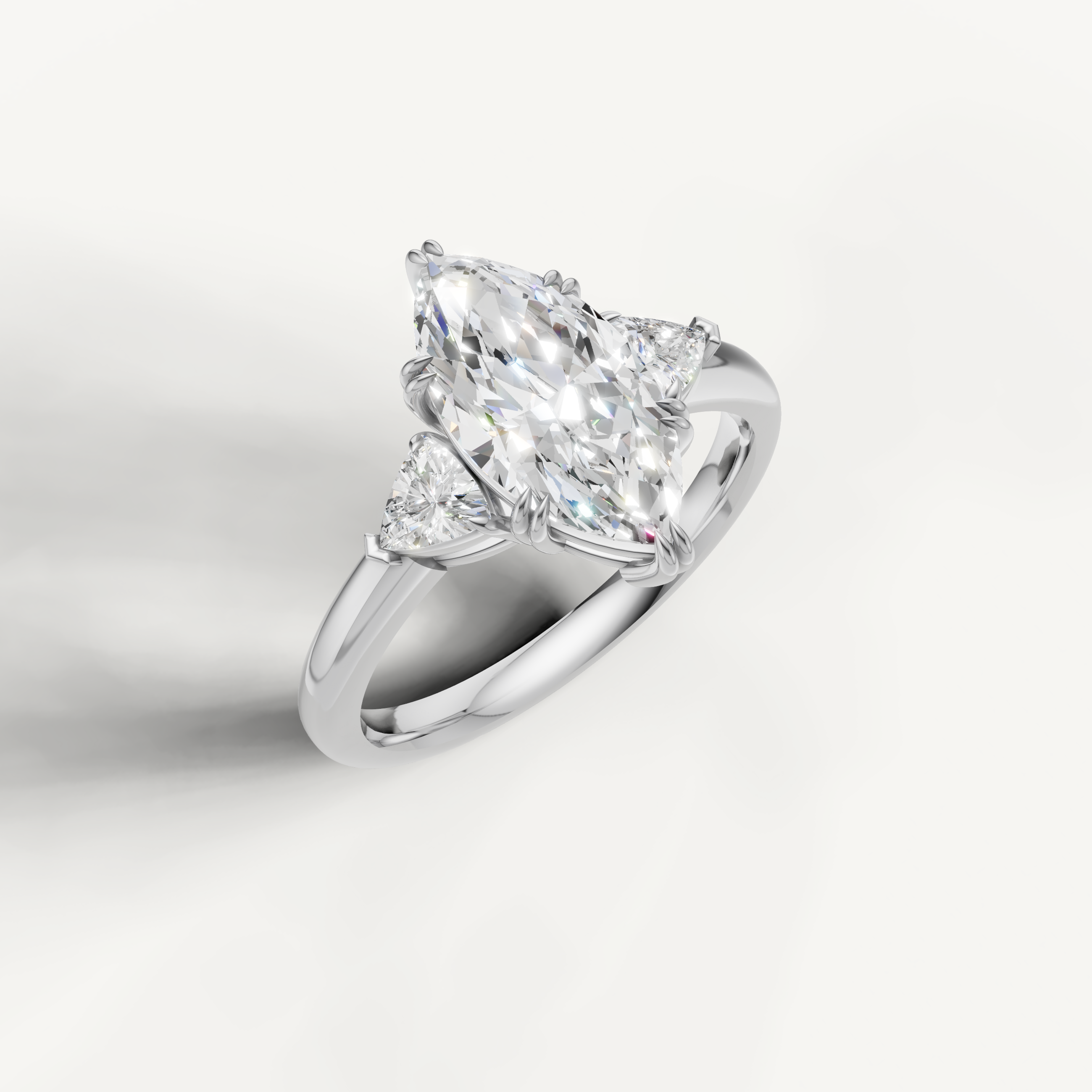 luxurious marquise lab grown diamond trilogy ring with brilliant trillion side diamonds