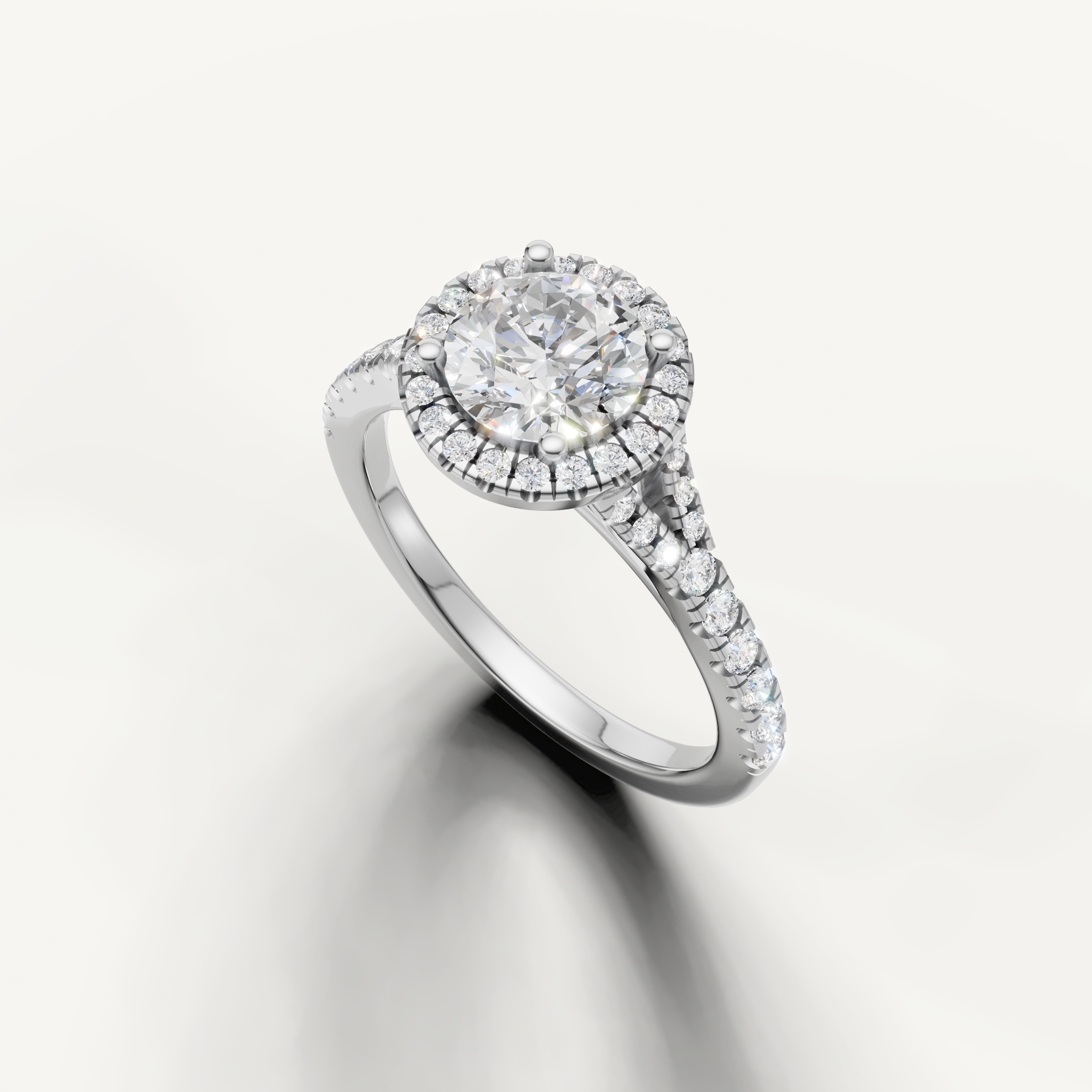 Classic round diamond halo ring with pavé band white gold