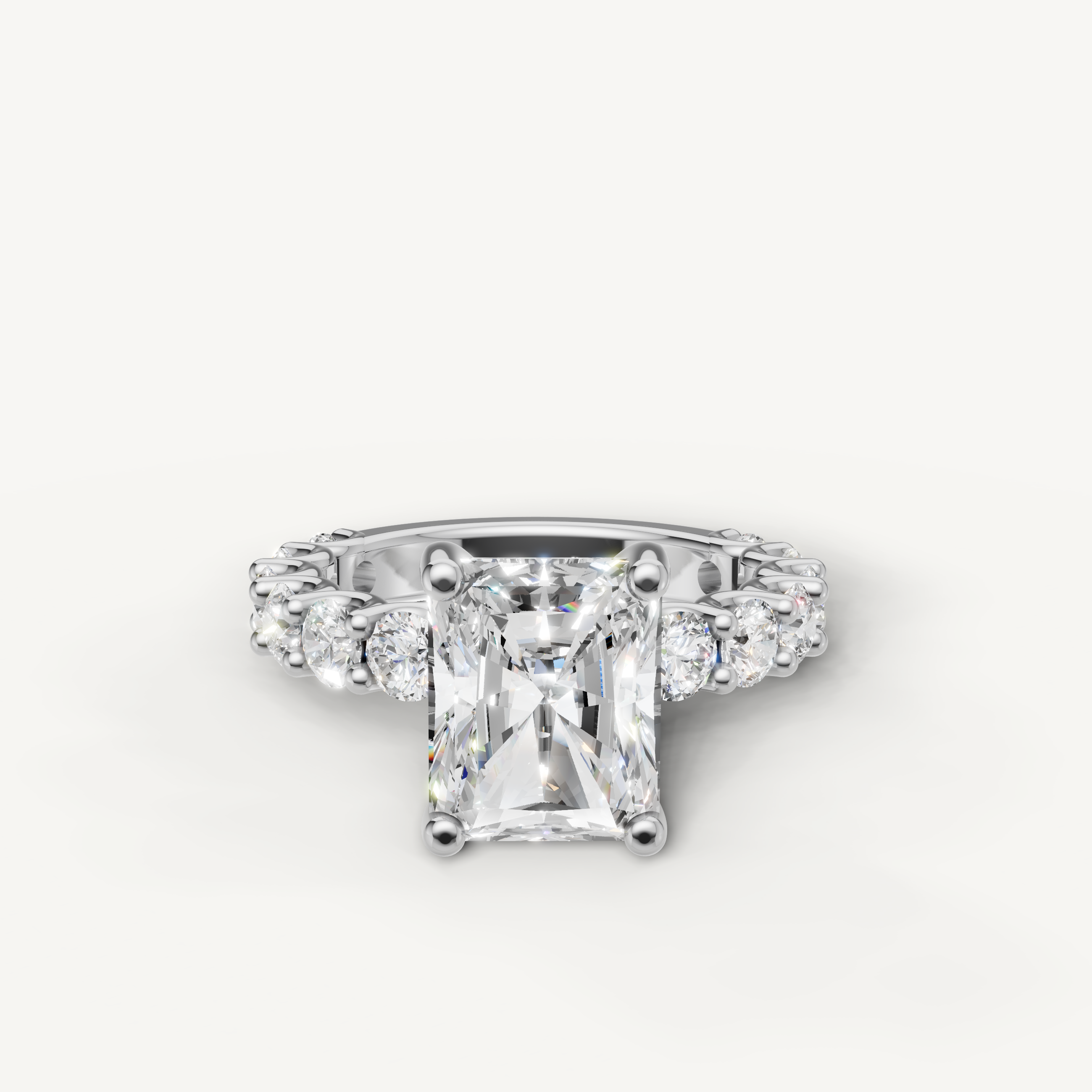 Radiant cut lab grown diamond engagement ring side view with shared prong eternity band in white gold