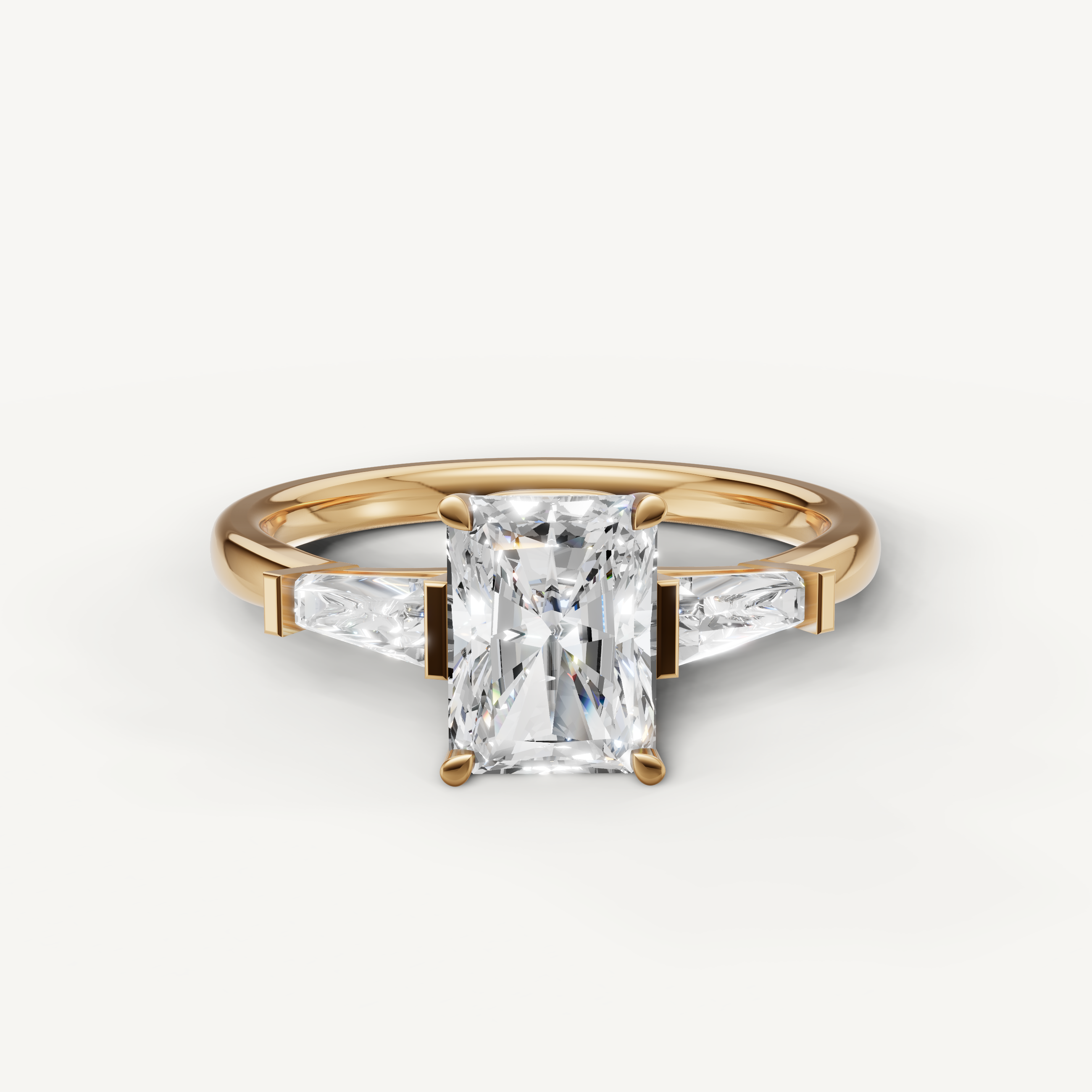 Radiant cut lab grown diamond ring with tapered baguette side stones yellow gold engagement ring