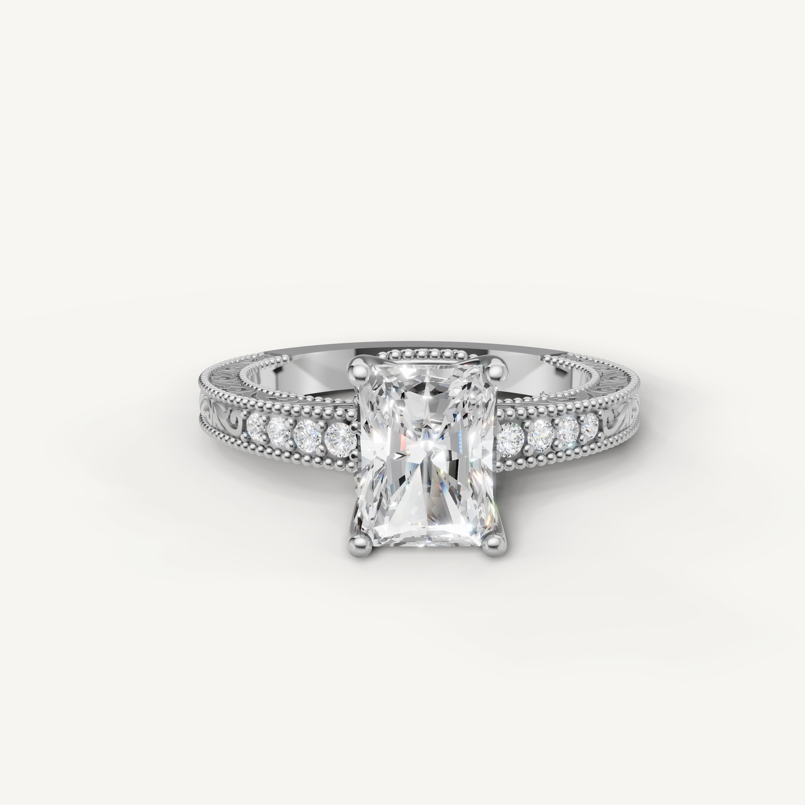 Vintage radiant cut lab grown diamond engagement ring in 14K white gold with ornate filigree and pavé accents by Raul Diamonds.