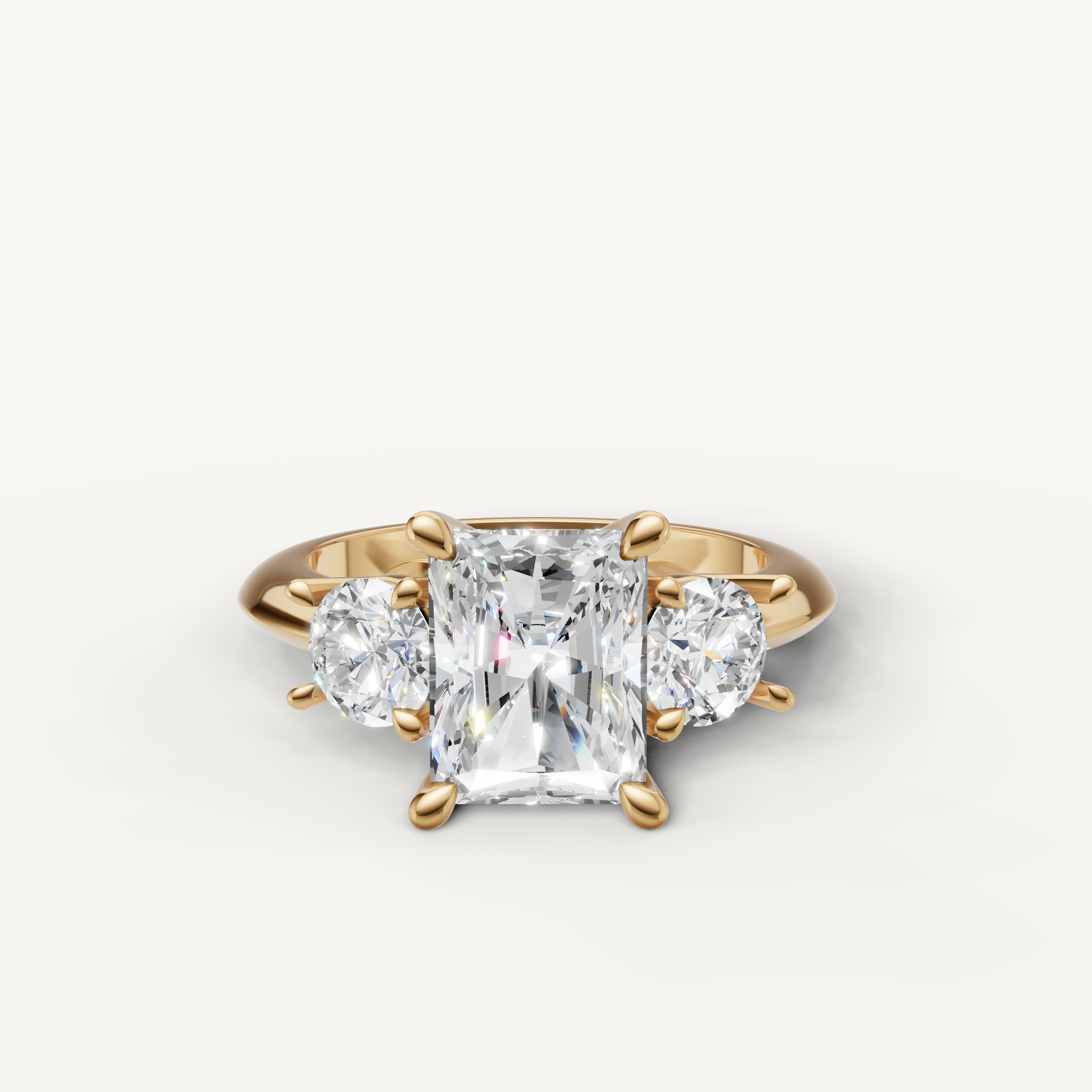 Radiant cut three stone lab grown diamond engagement ring in 14K yellow gold