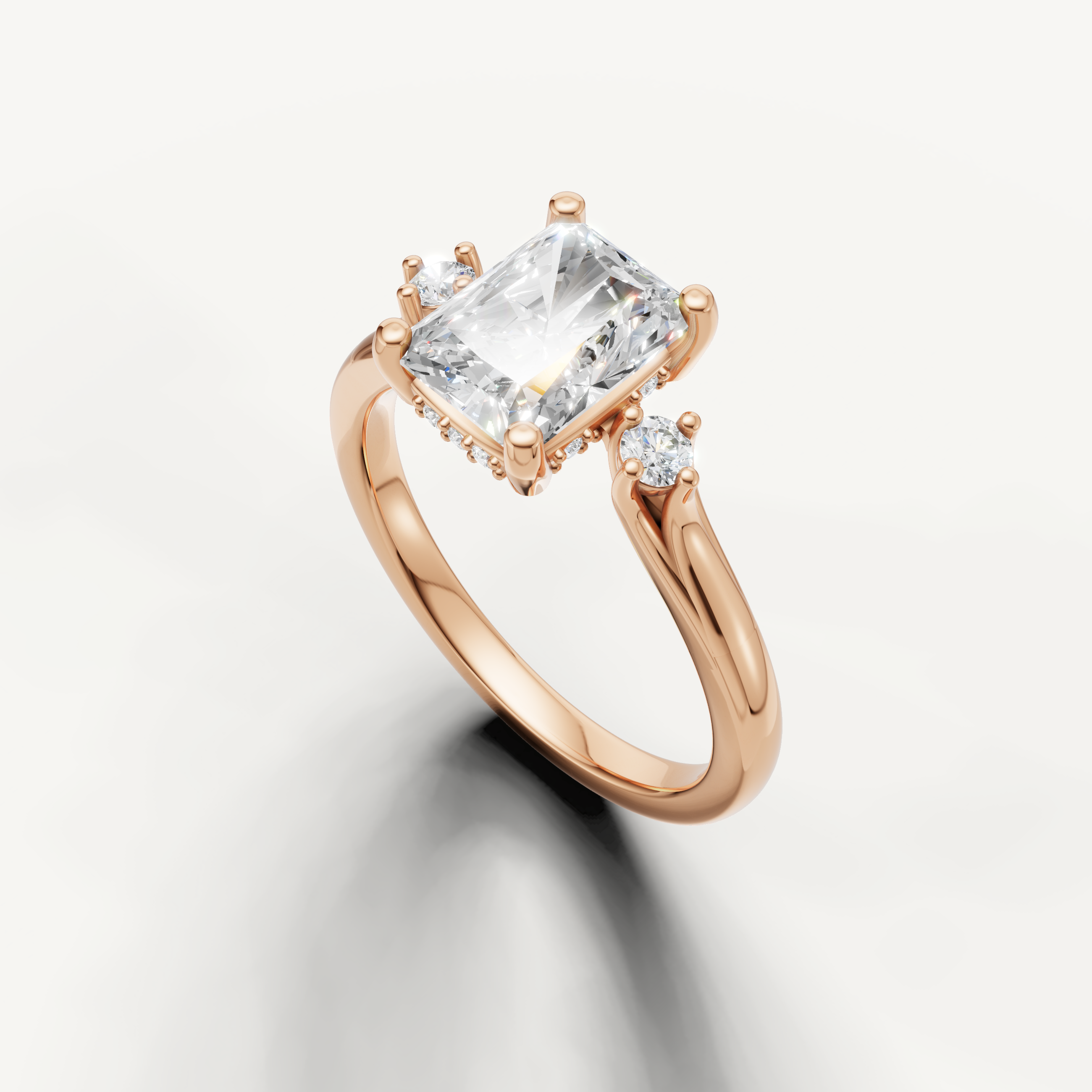 Romantic rose gold radiant cut diamond ring with elongated silhouette and brilliant fire