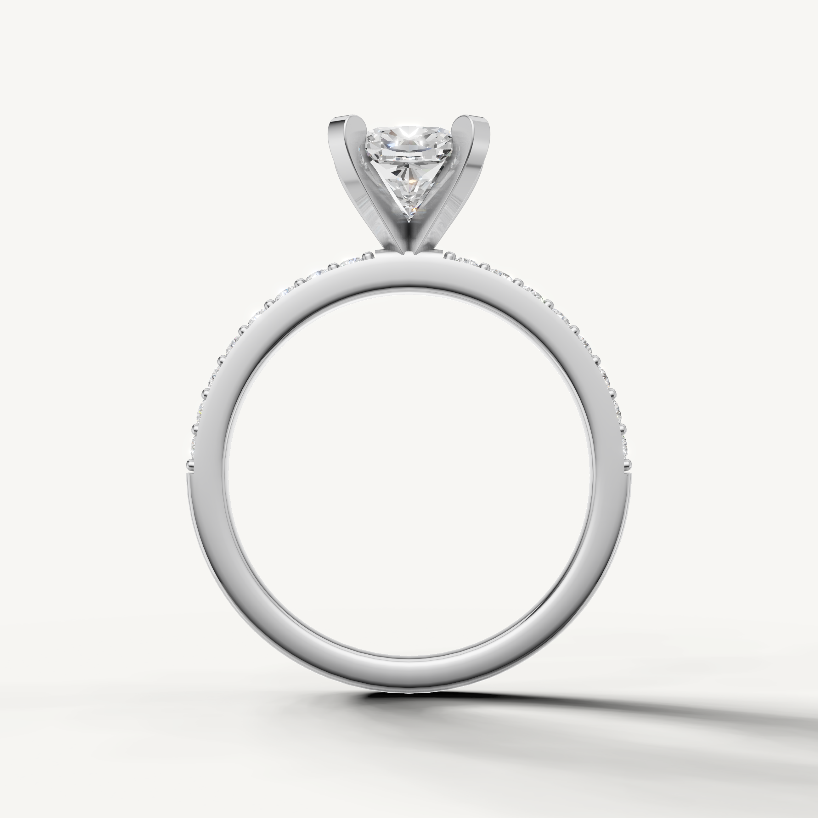 Classic cushion cut engagement ring in white gold with pavé diamonds