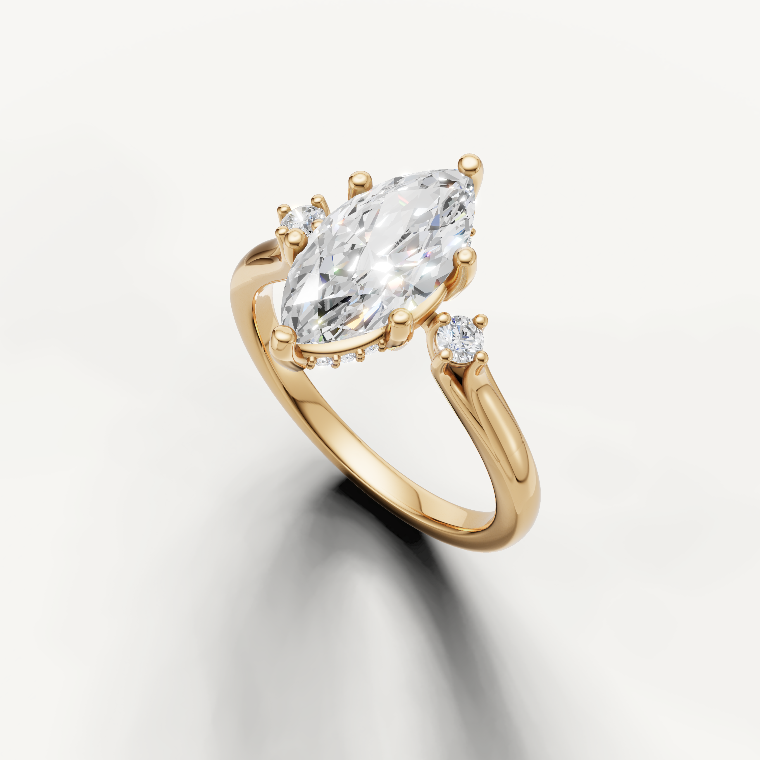 Raul Diamonds yellow gold marquise engagement ring with timeless three stone design