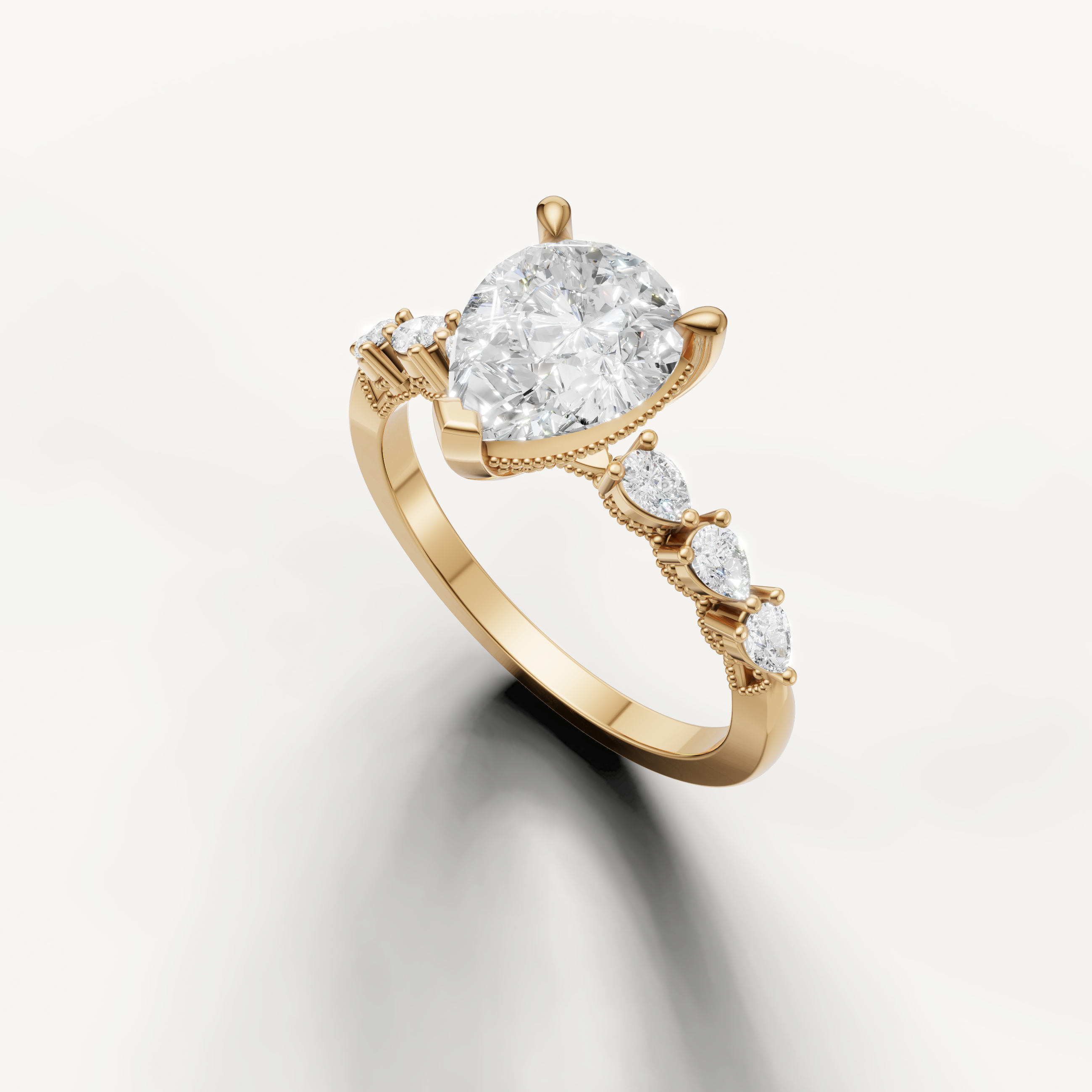 14K yellow gold pear cut engagement ring featuring lab grown diamond center stone and marquise side diamonds