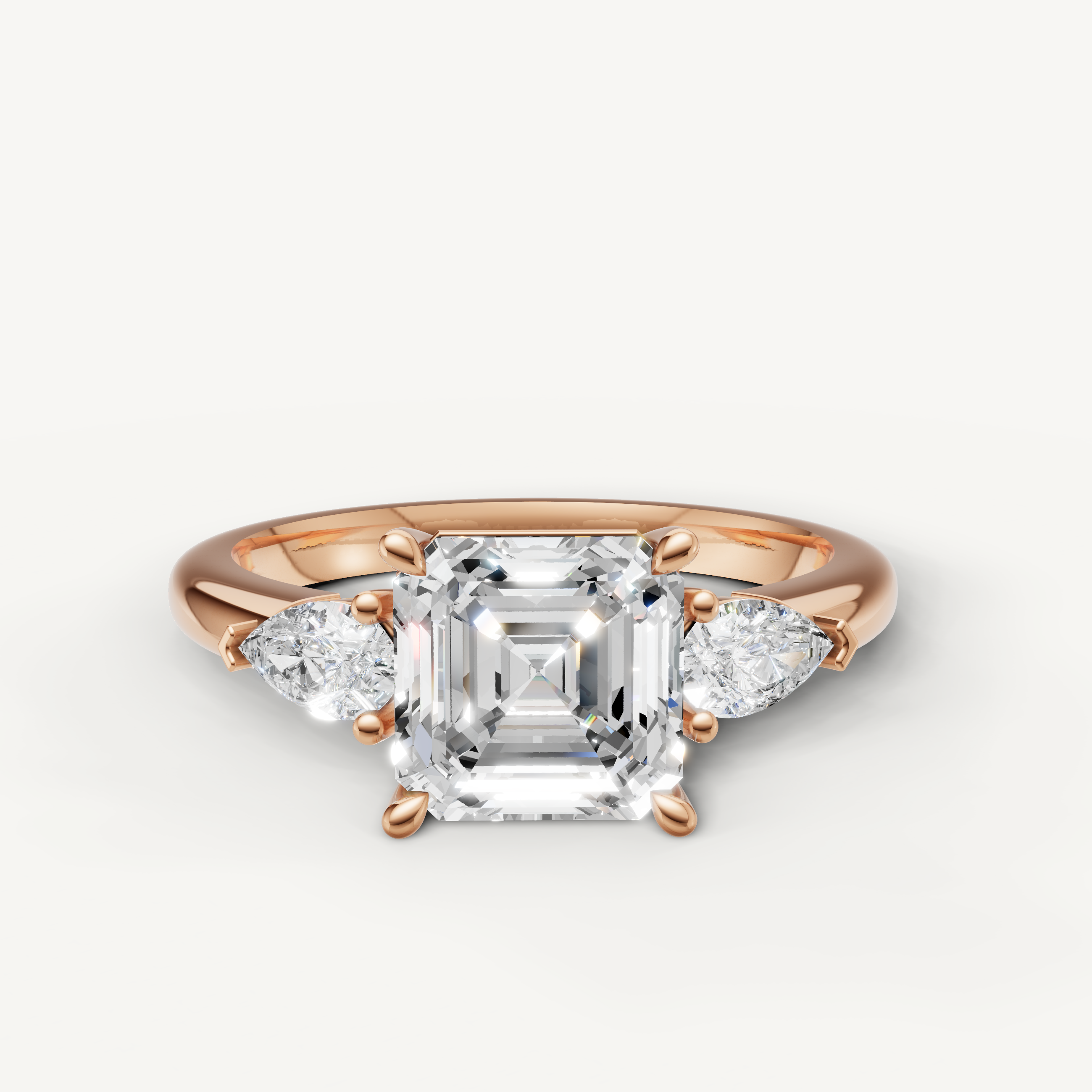 asscher cut lab grown diamond engagement ring with pear side stones rose gold