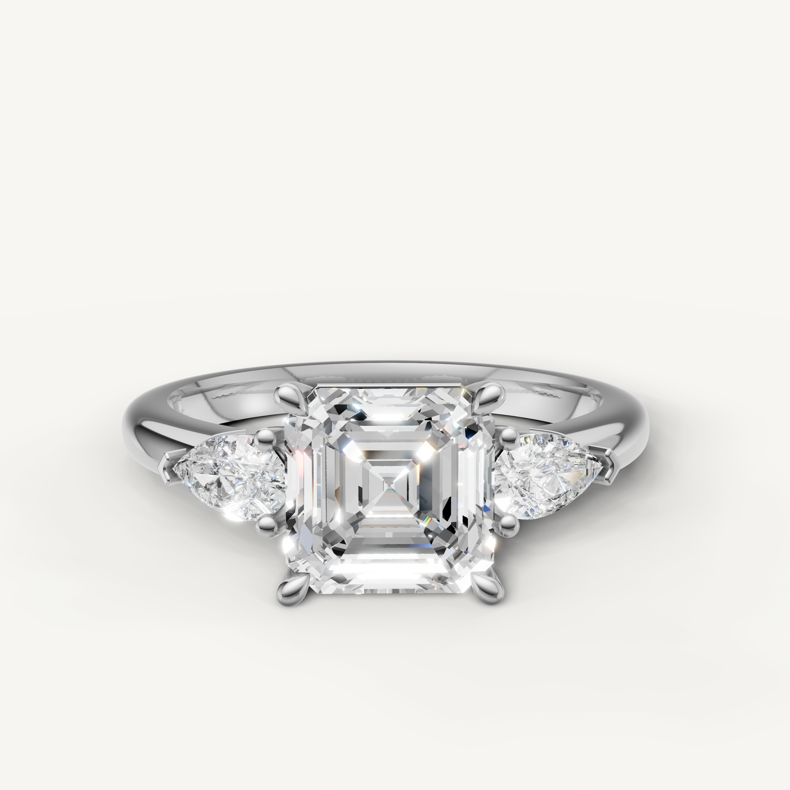 asscher cut lab grown diamond engagement ring with pear side stones white gold