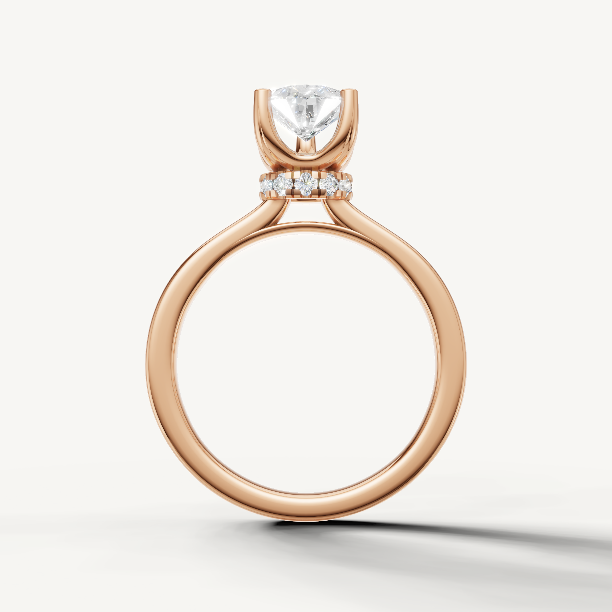 minimalist pear shaped lab grown diamond engagement ring with refined rose gold setting