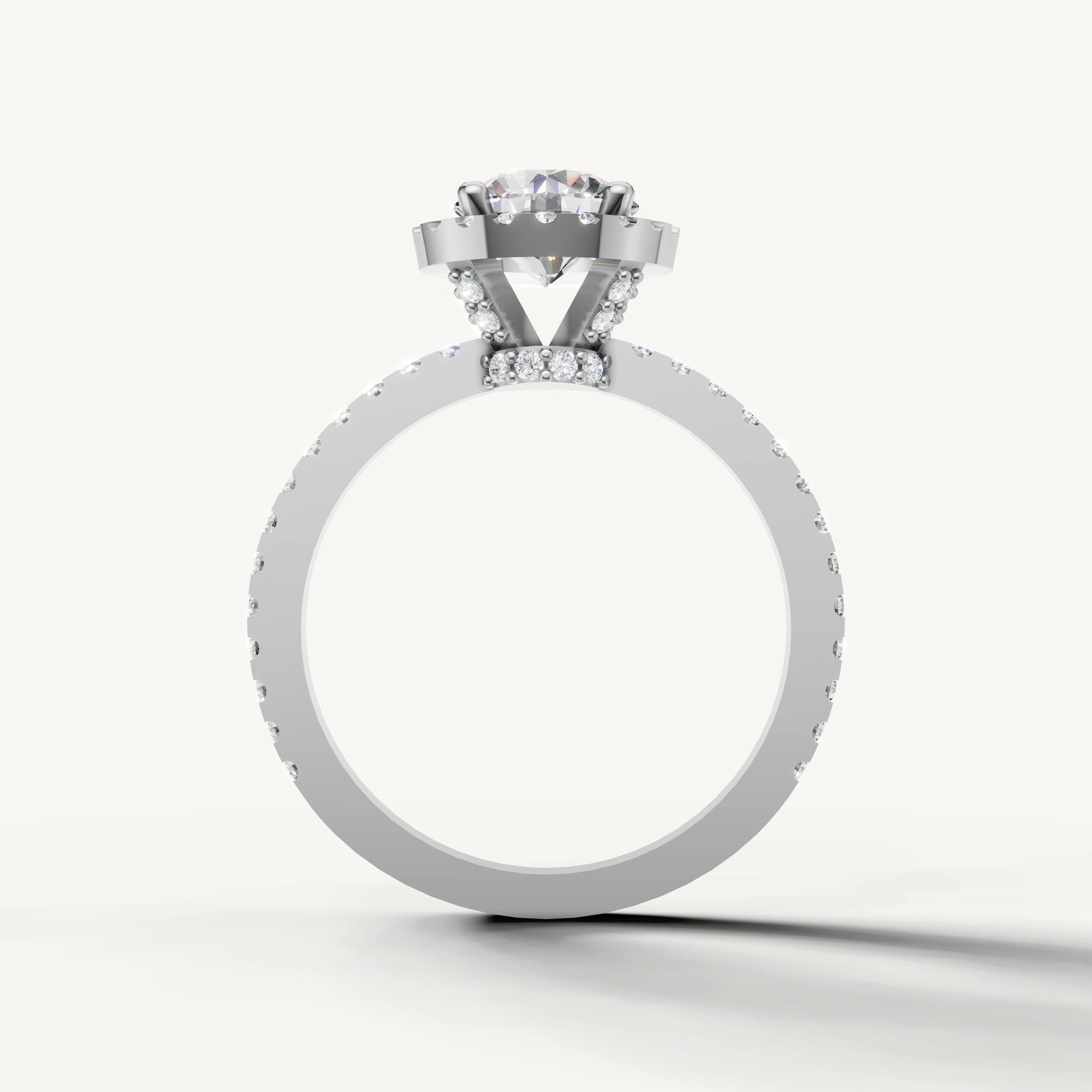 Timeless round halo diamond ring with elegant pavé setting by Raul Diamonds.