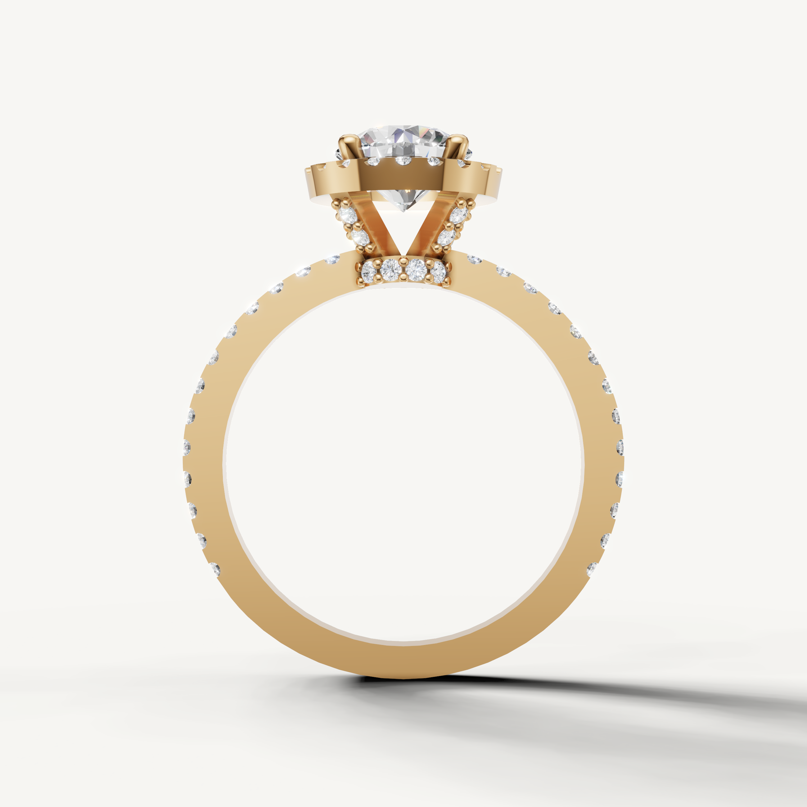 Elegant round diamond engagement ring with pavé band from Raul Diamonds.