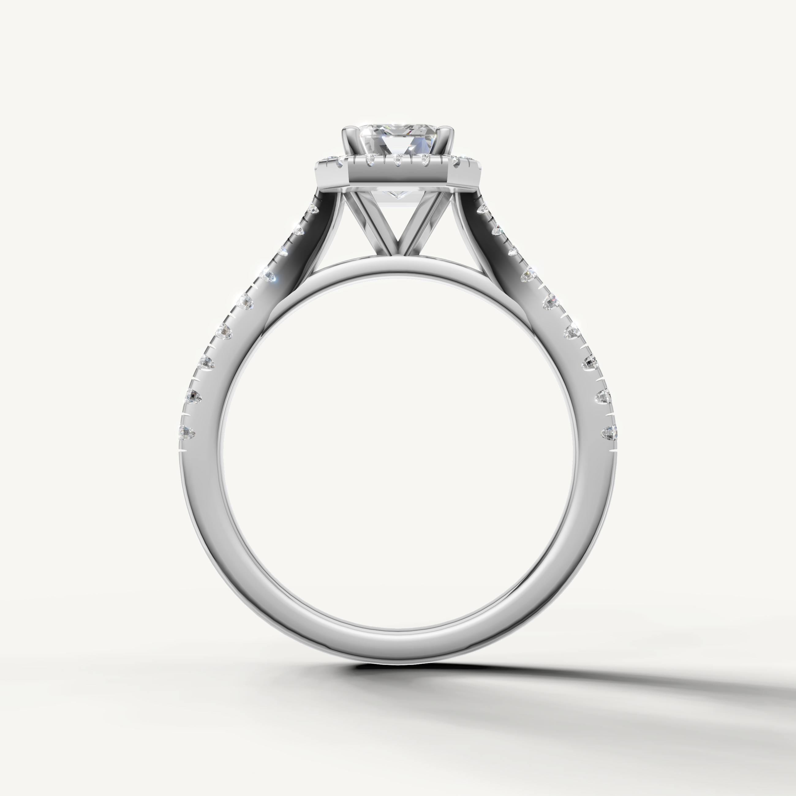 Classic emerald cut diamond halo ring with pavé band white gold