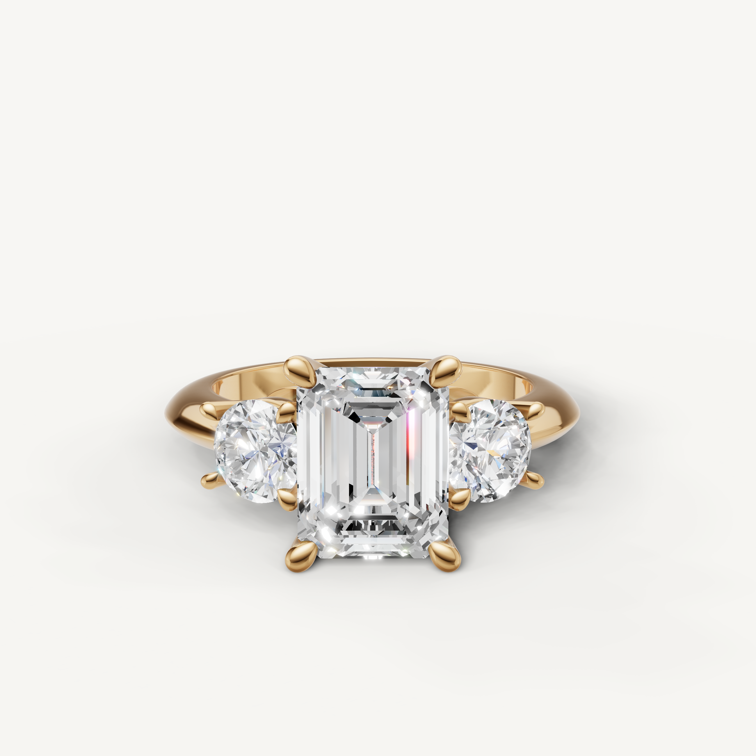 Emerald cut three stone lab grown diamond engagement ring in 14K yellow gold