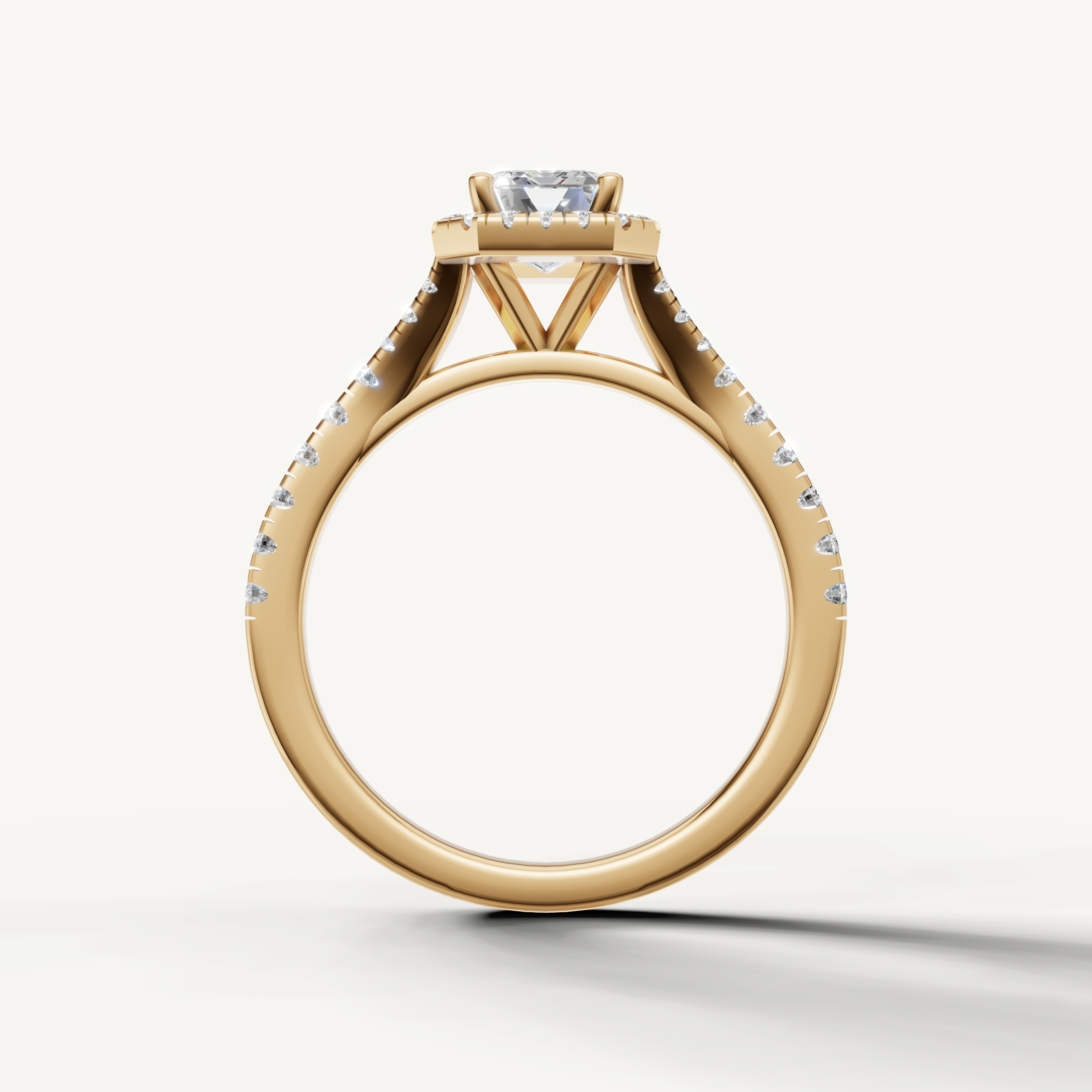 Elegant emerald cut engagement ring with halo and pavé band yellow gold