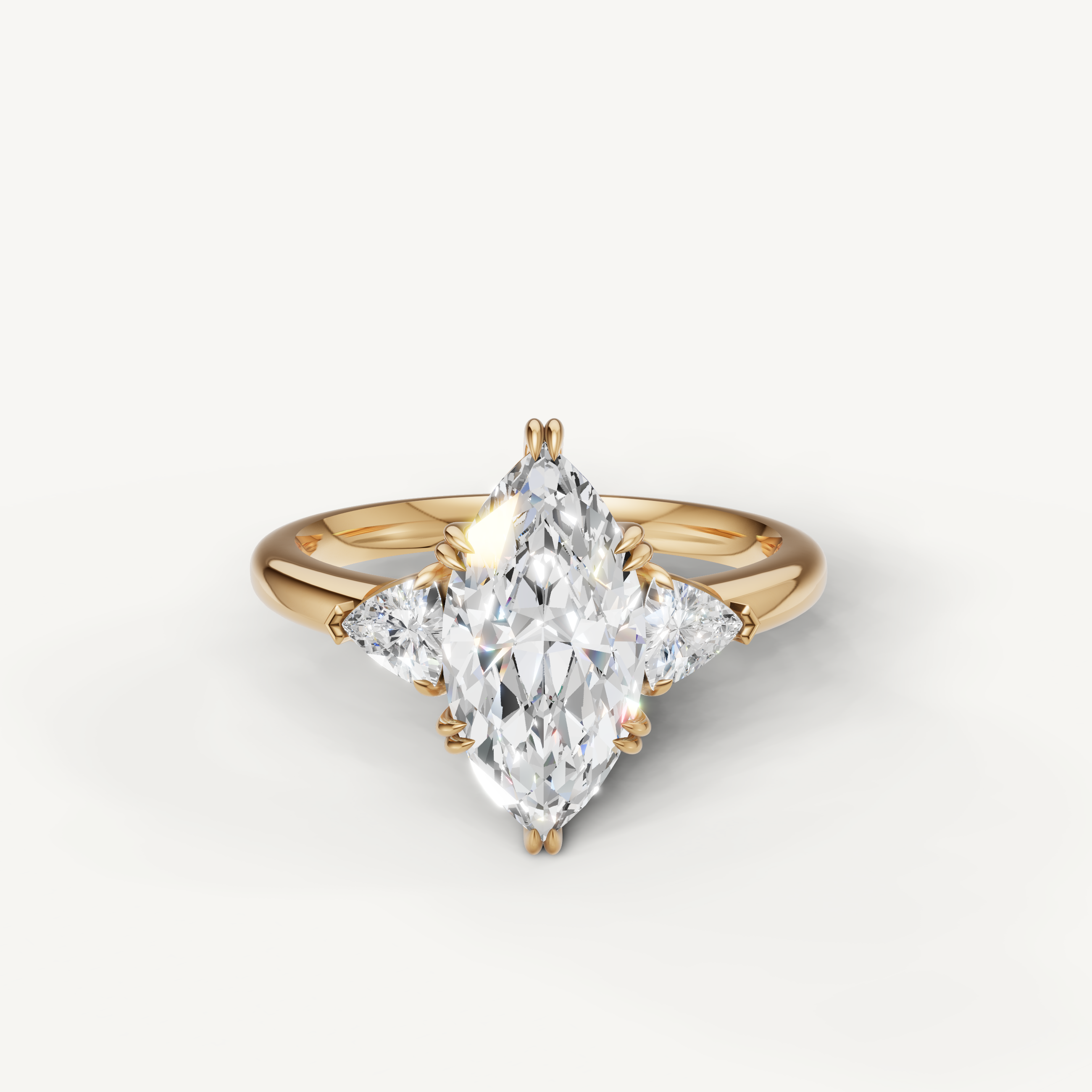 marquise cut lab grown diamond engagement ring with trillion side stones in 14k yellow gold
