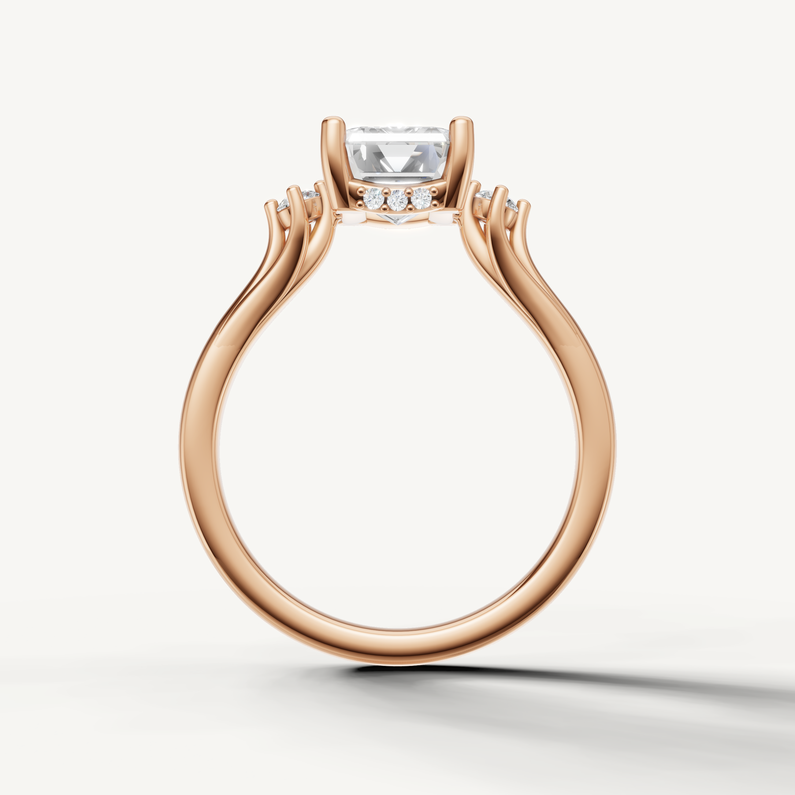 Modern emerald cut lab grown diamond ring in rose gold with elegant four prong setting
