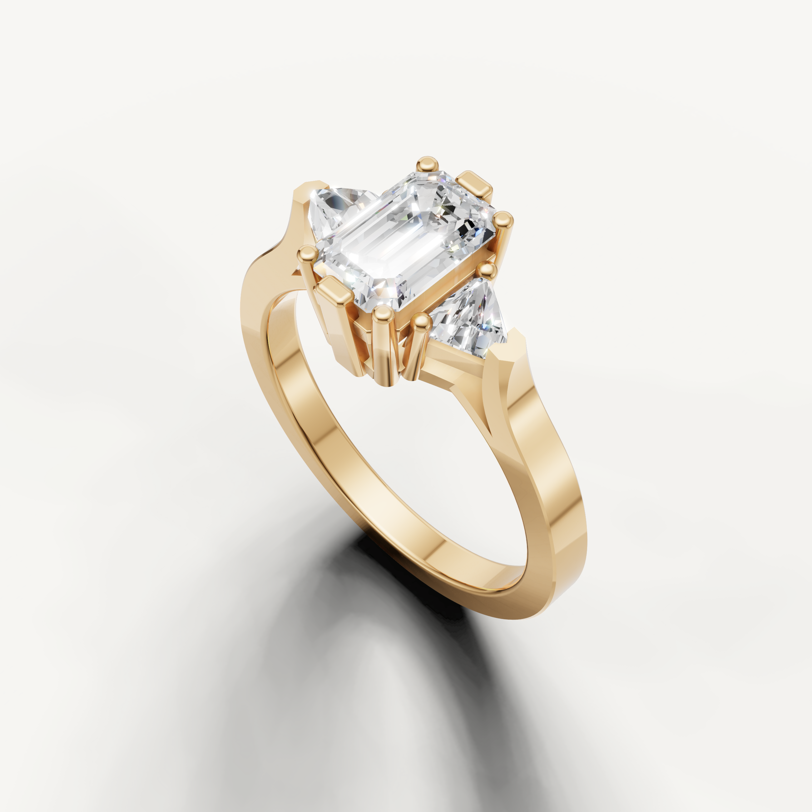 Yellow gold emerald cut solitaire engagement ring with clean contemporary style.