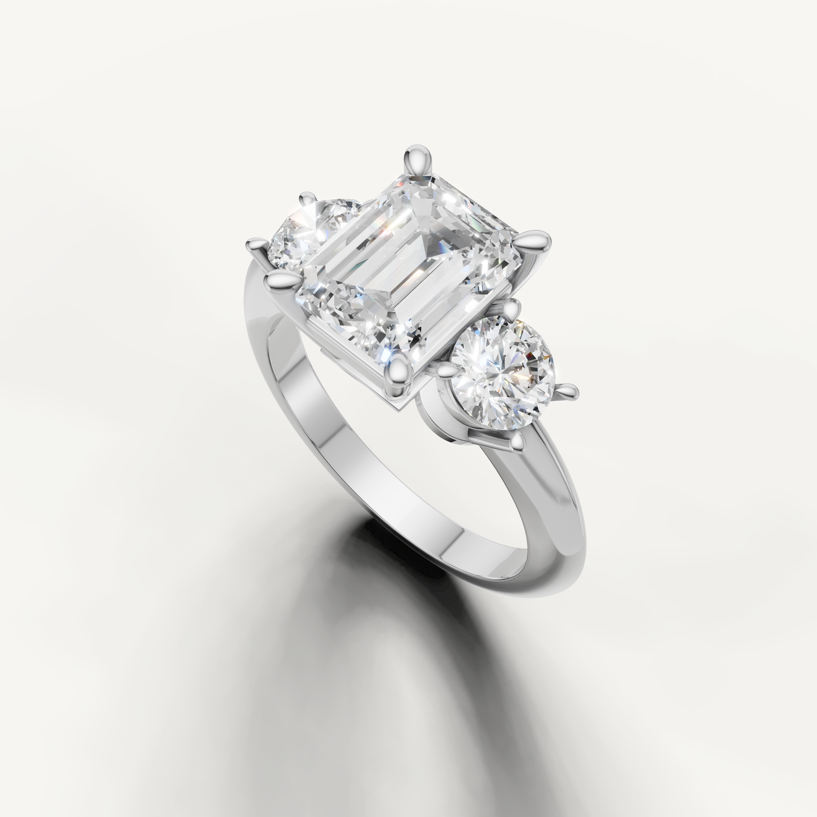Three stone emerald cut lab grown diamond ring in white gold classic setting