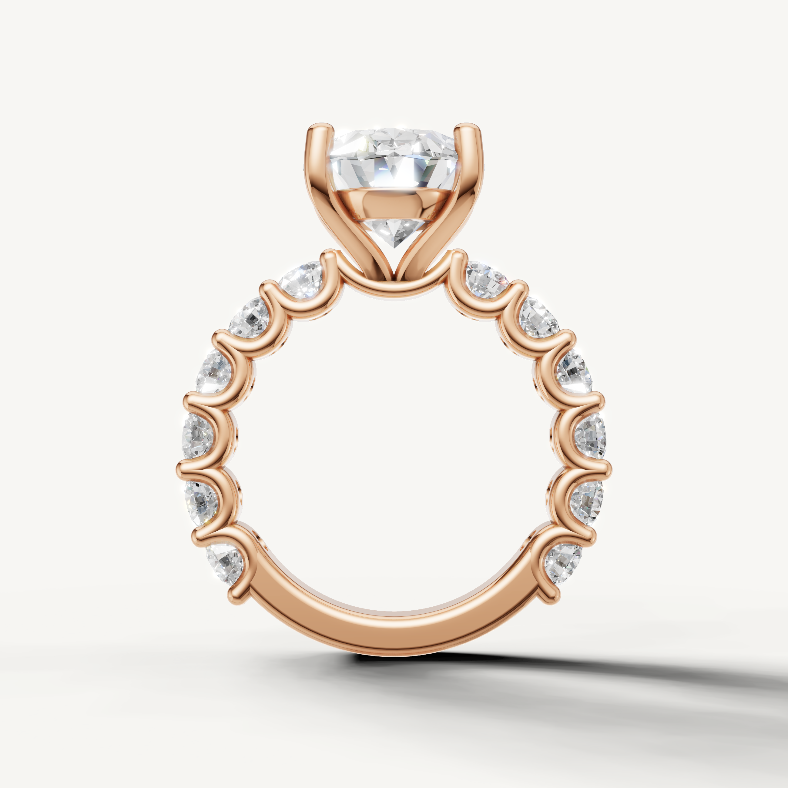 Oval engagement ring with open gallery shared prong band rose gold