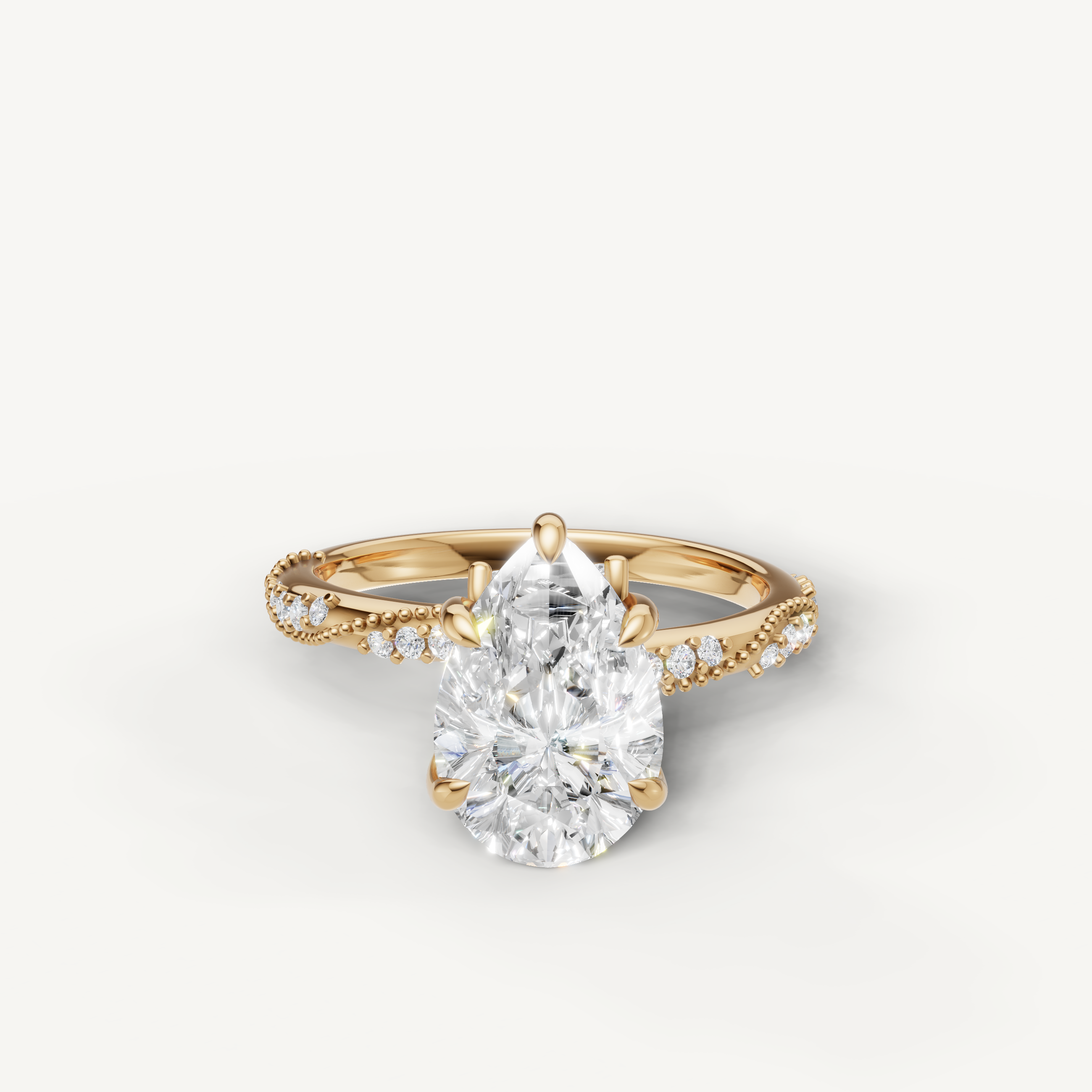 pear cut lab grown diamond engagement ring with twisted pavé band yellow gold