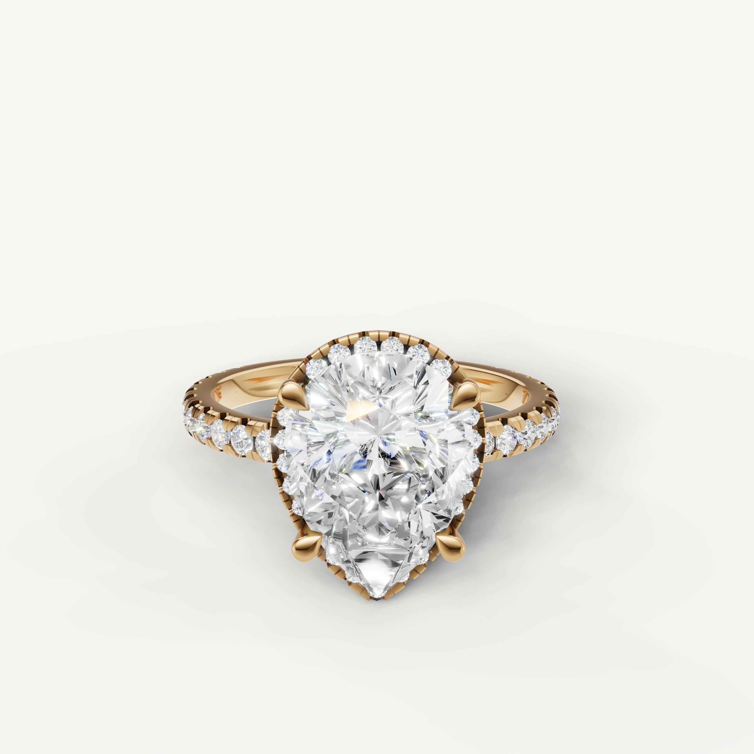 Pear cut lab grown diamond engagement ring with hidden halo pavé band yellow gold
