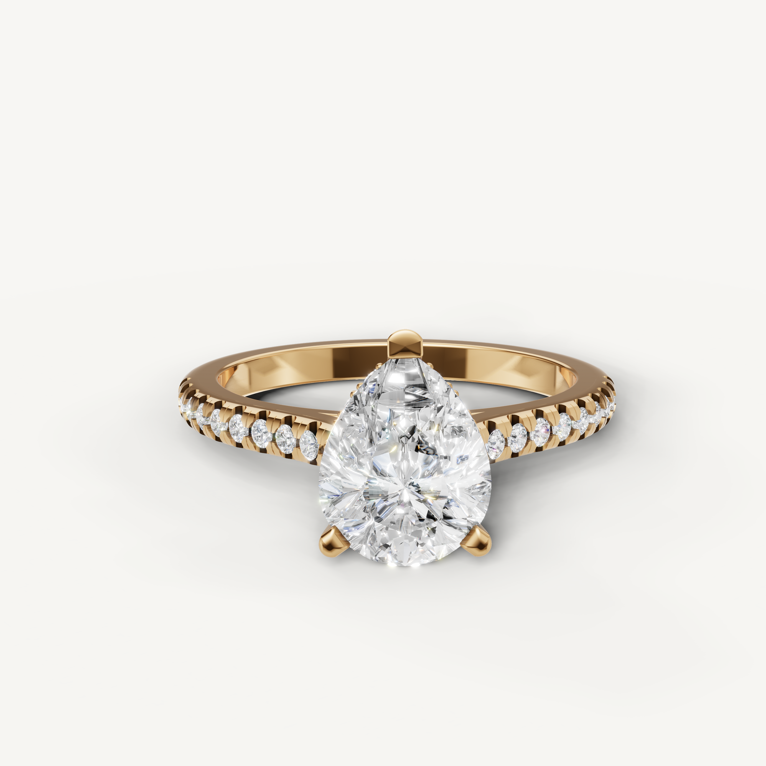 Pear cut lab grown diamond engagement ring with pavé band in 14K yellow gold by Raul Diamonds