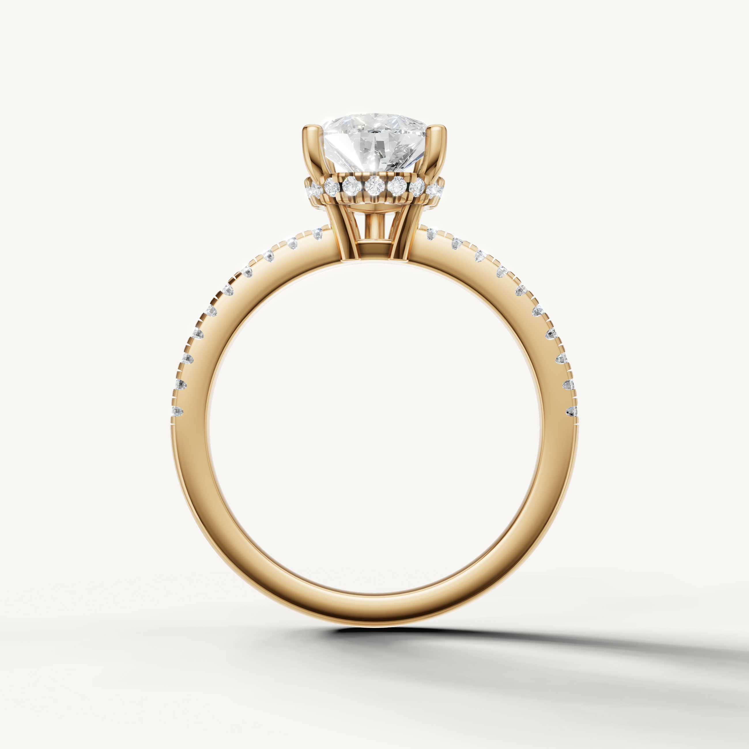 elegant pear cut engagement ring with sparkling pavé diamonds and yellow gold setting