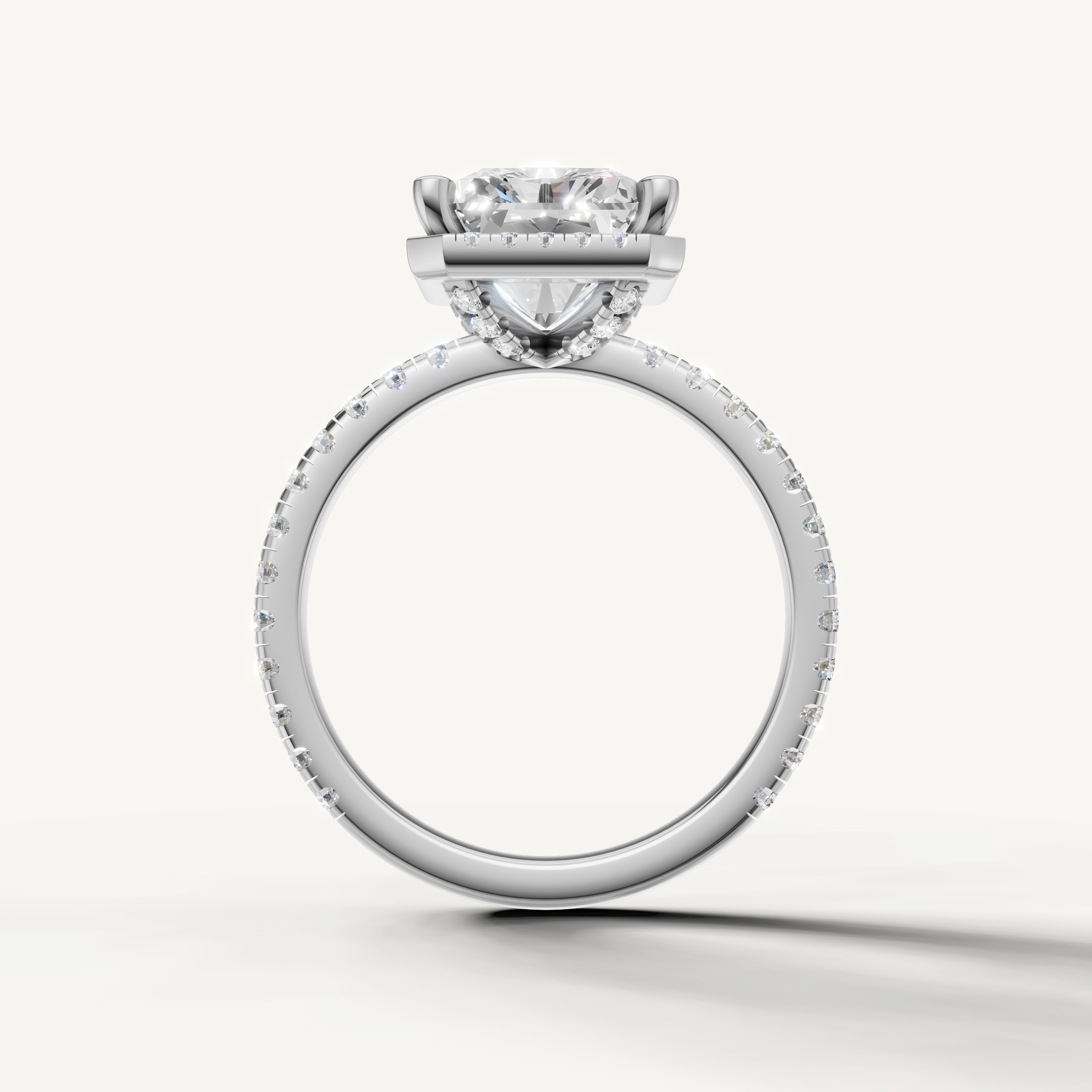 Radiant shape diamond engagement ring with pavé band and hidden halo white gold