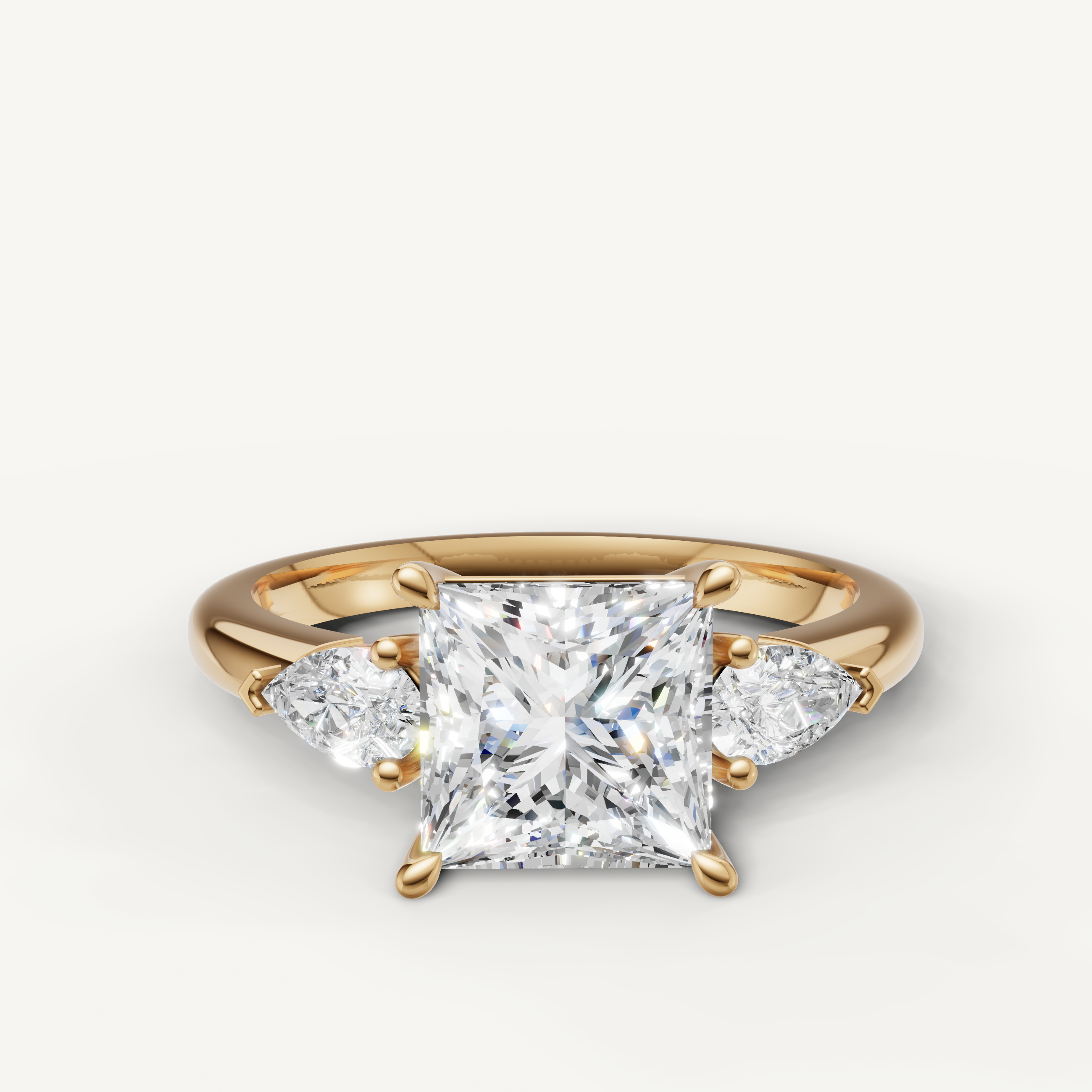 princess cut lab grown diamond engagement ring with pear side stones in 14k yellow gold