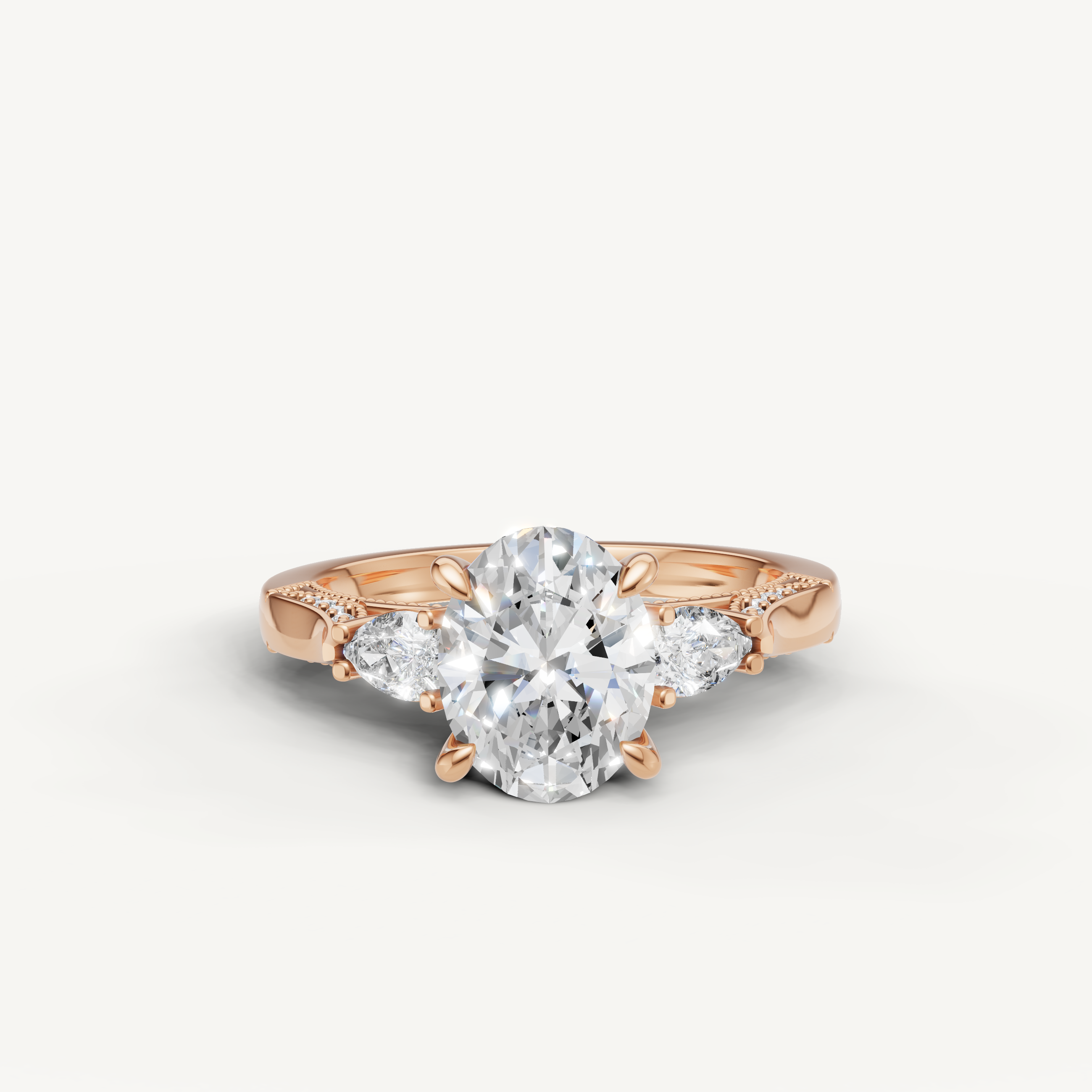 Oval cut lab grown diamond three stone ring with pear side stones rose gold engagement ring