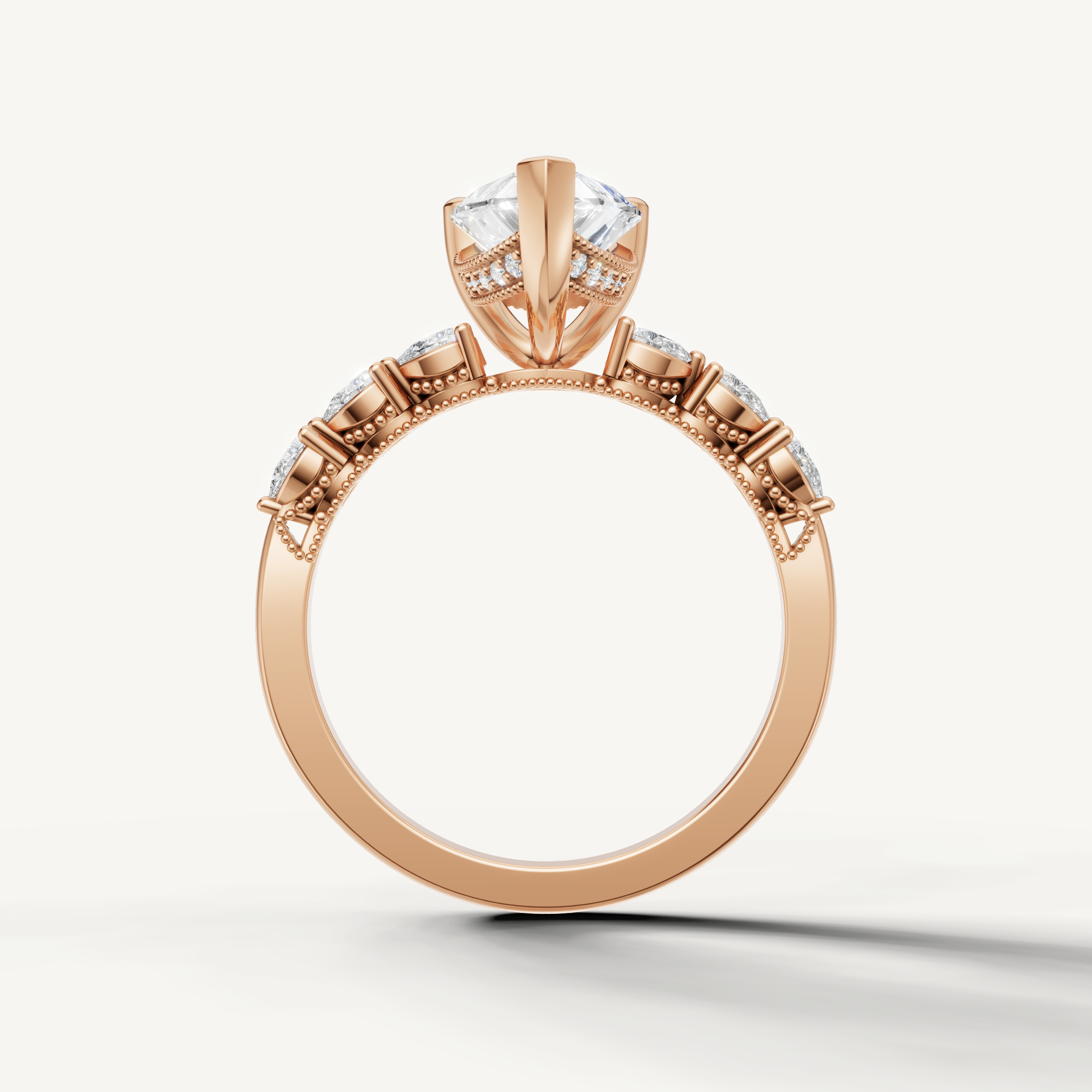 Pear shaped lab grown diamond solitaire ring in rose gold with marquise accent diamonds by Raul Diamonds