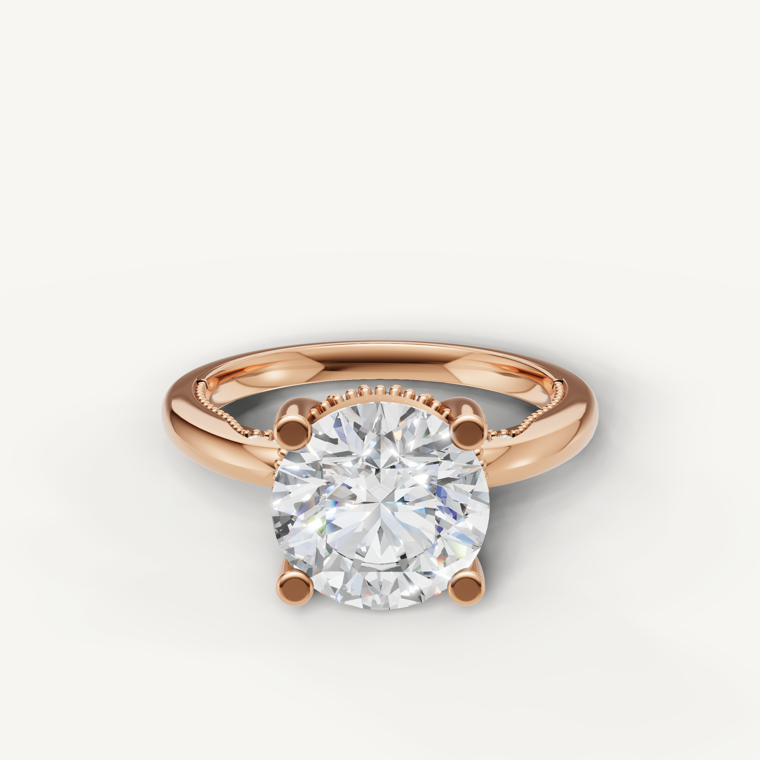 A romantic and modern engagement ring crafted in blushing 14k rose gold, featuring a striking round-cut diamond held by delicate prongs.