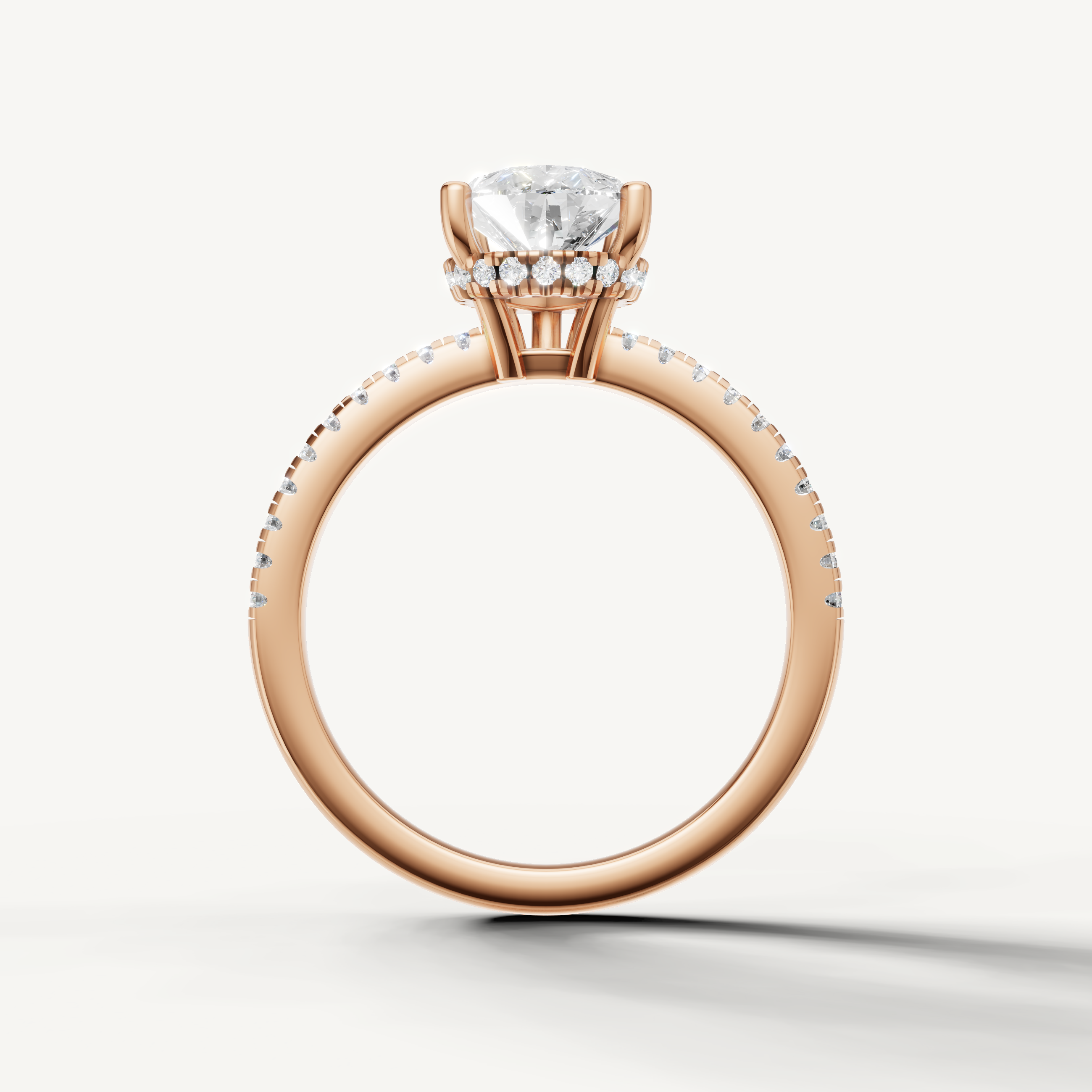 elegant pear cut engagement ring with sparkling pavé diamonds and rose gold setting
