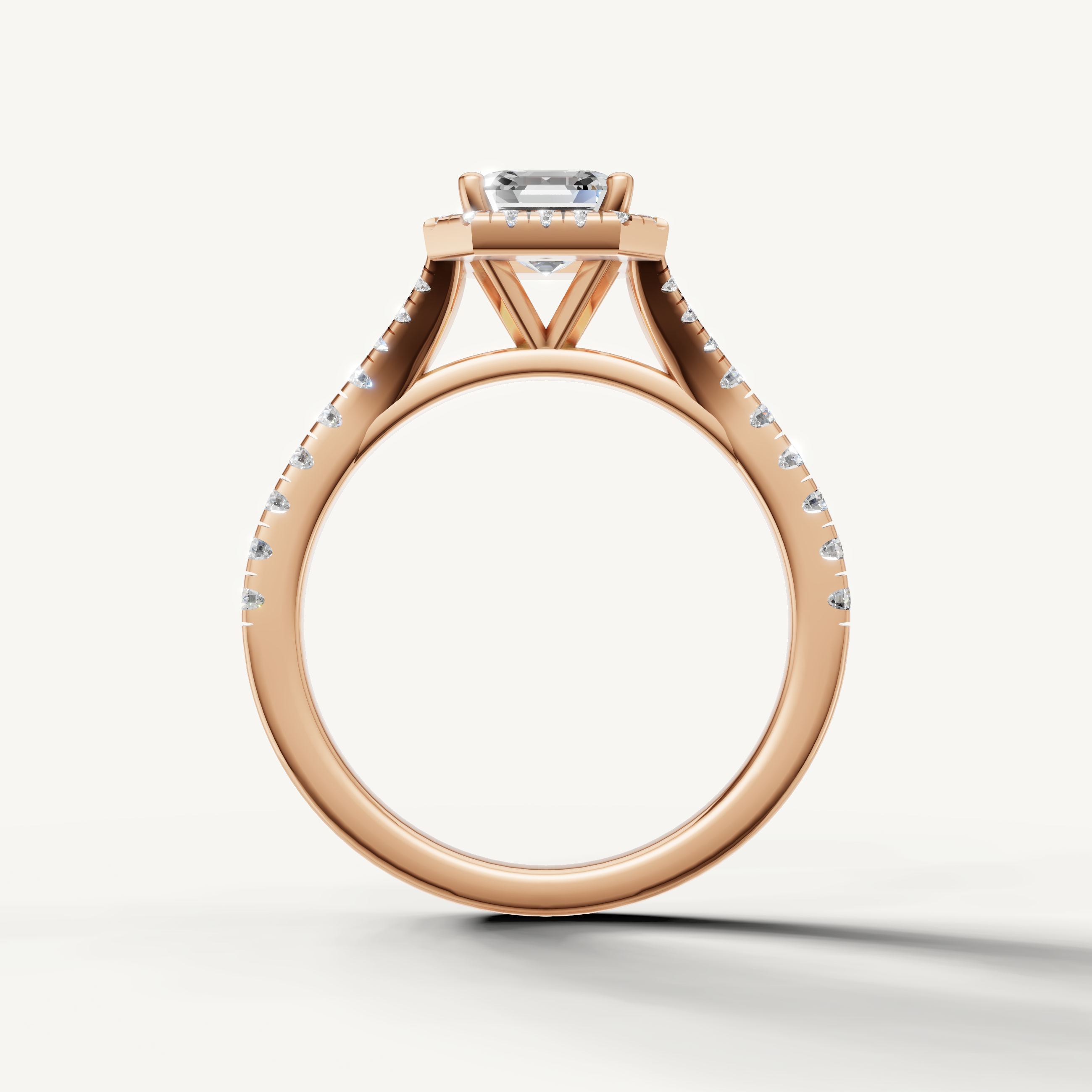 Elegant asscher diamond engagement ring with halo and pavé band rose gold