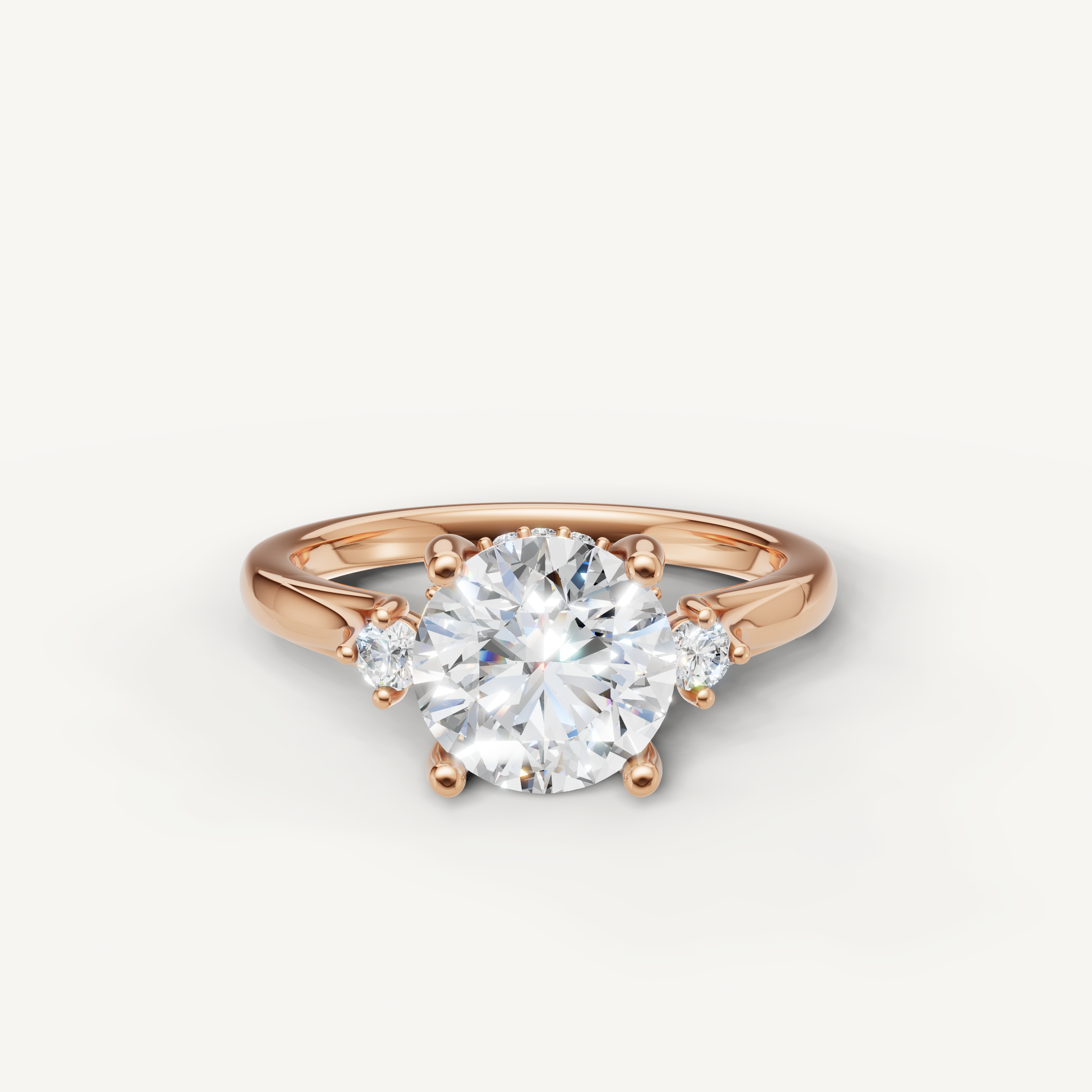 Round cut lab grown diamond engagement ring in 14K rose gold with petite side diamonds