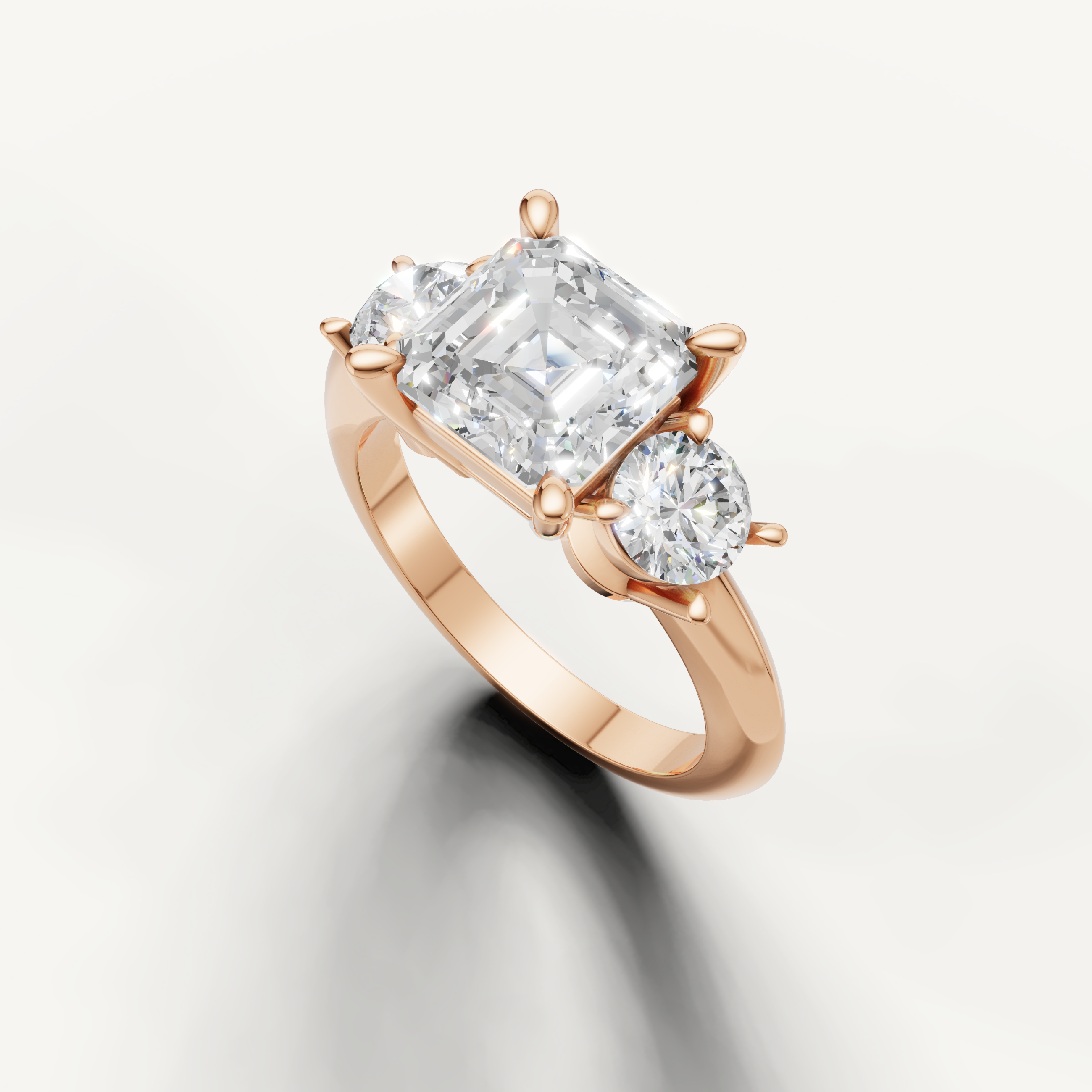 Three stone asscher cut diamond ring in rose gold classic engagement setting