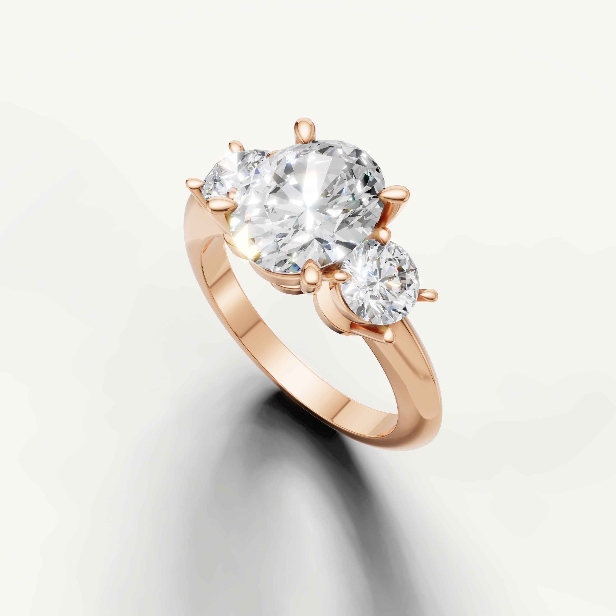 Three stone oval diamond ring in rose gold classic engagement setting