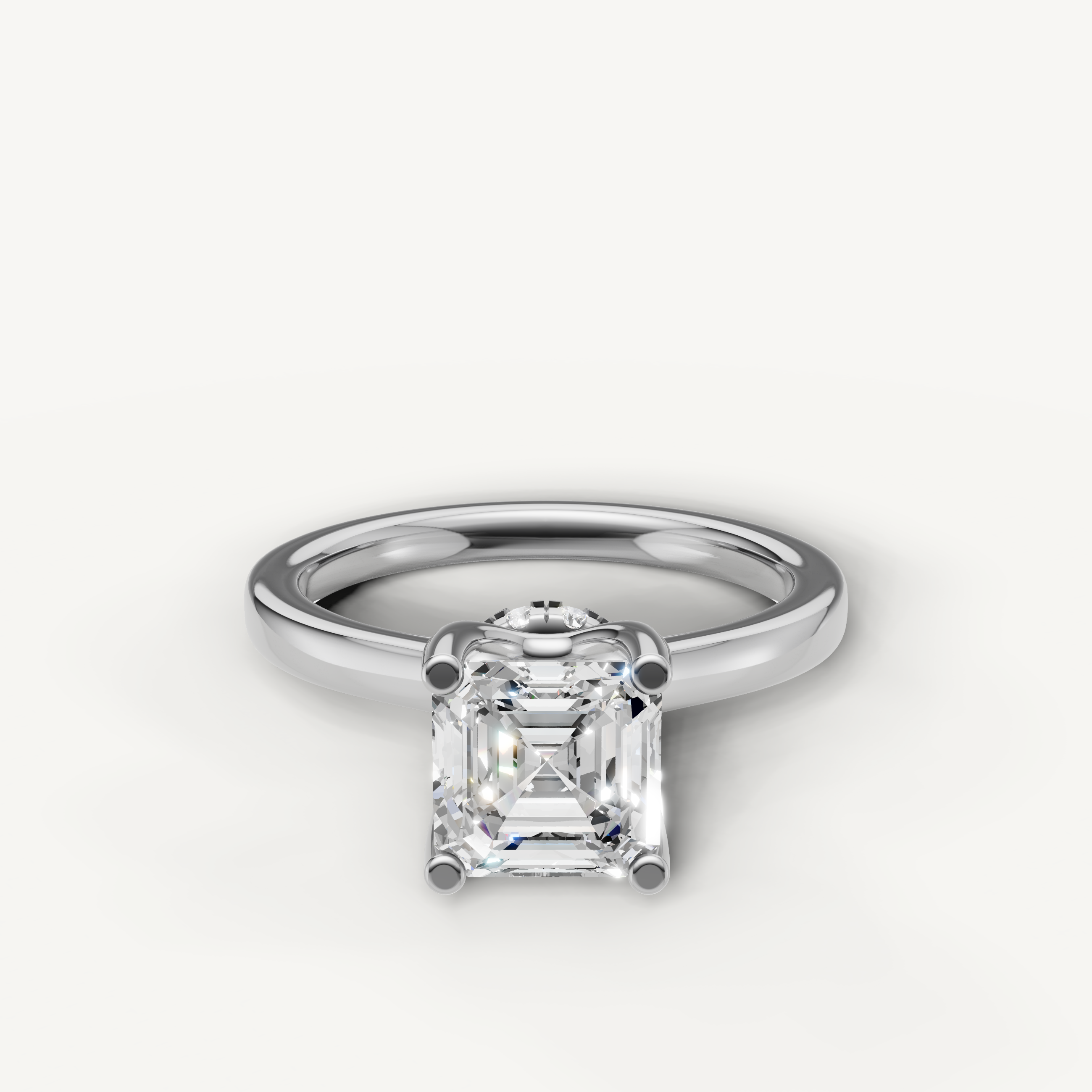 A classic solitaire engagement ring in bright, polished white gold or platinum, featuring a dazzling, high-clarity Asscher-cut diamond.